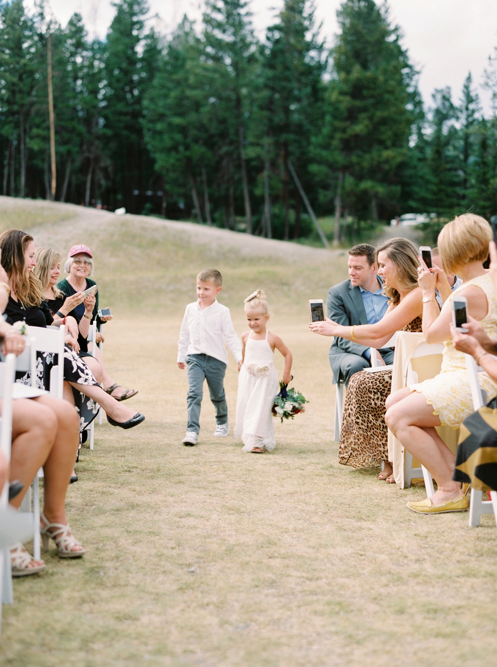 Banff Wedding Photographers | wedding ceremony tunnel mountain | flower girl and ring bearer | Justine Milton fine art film photographers