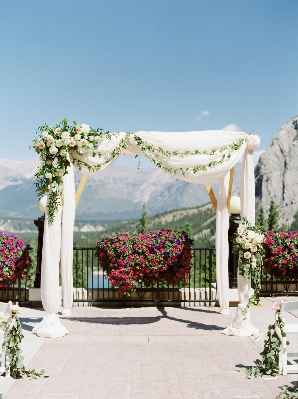 Wedding ceremony floral arch way decor at the Fairmont Banff Springs Hotel | Banff Rocky Mountain Wedding Photographers | Justine Milton fine art film photography