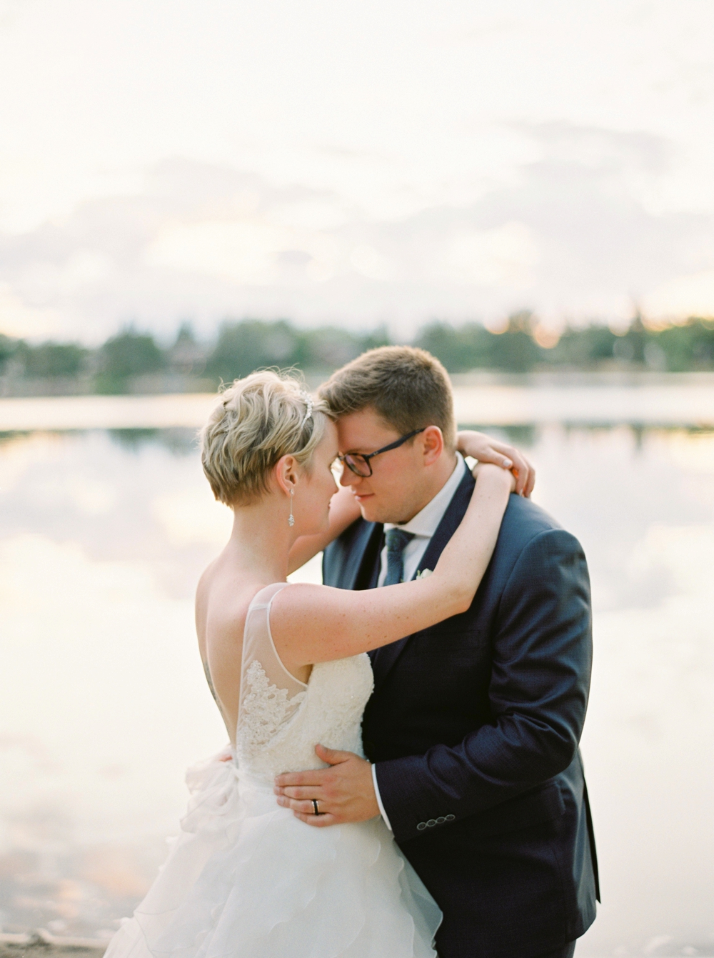 Calgary wedding photographers | The lake house wedding | The Lake House on Lake Bonavista Bride and groom photos with ducks | Justine Milton Photography
