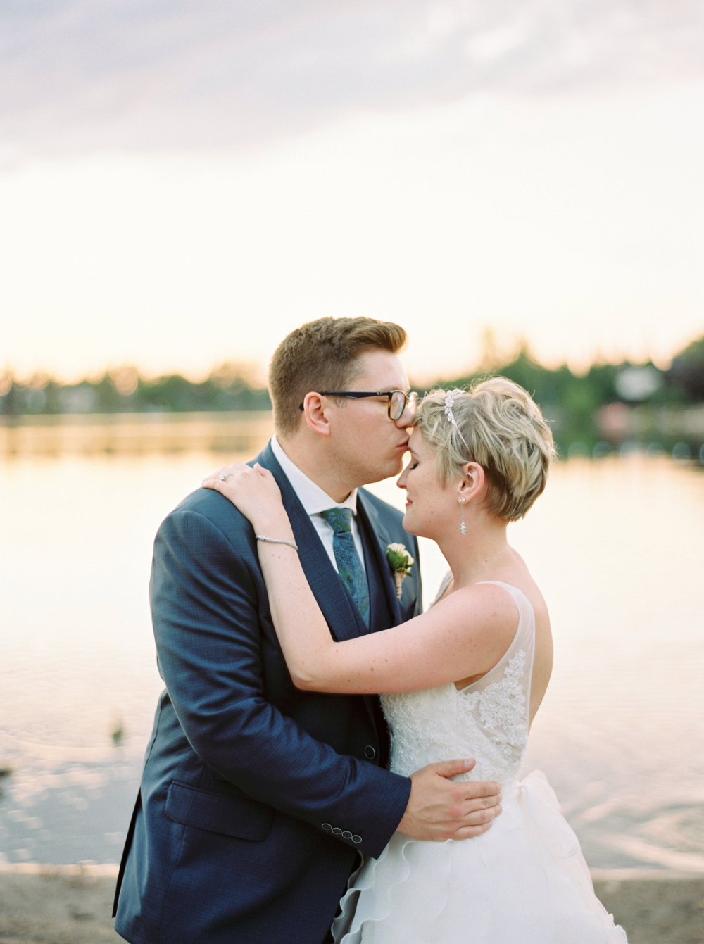 Calgary wedding photographers | The lake house wedding | The Lake House on Lake Bonavista Bride and groom photos with ducks | Justine Milton Photography