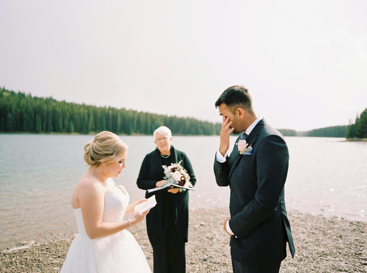Calgary wedding photographers | banff wedding photographers | fine art film | Justine Milton Photography | wedding vows | elopement photographers | bride and groom ceremony