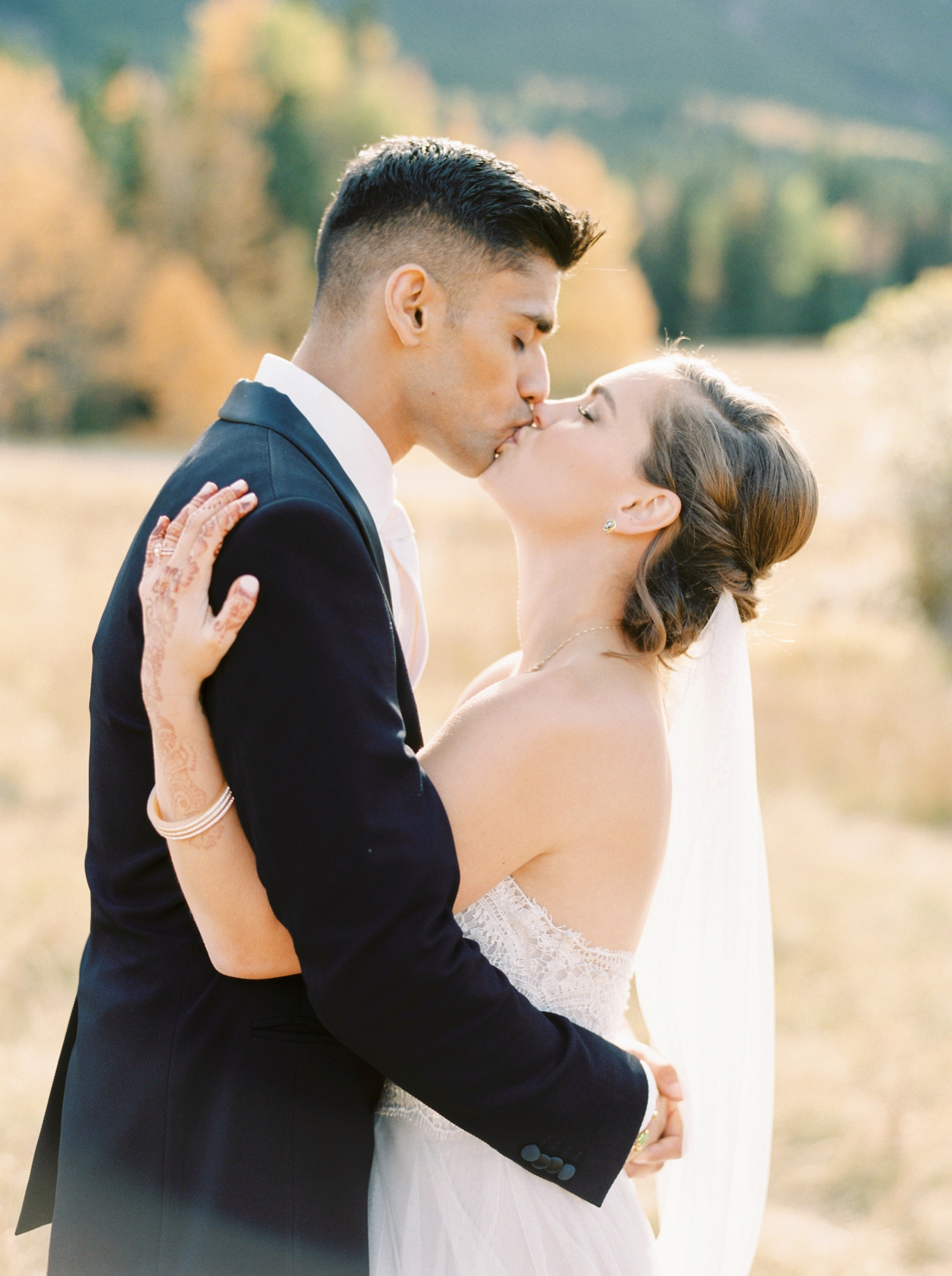Calgary wedding photographers | fine art film | Justine Milton Photography | canmore wedding photographers | bride and groom portraits | mountain photography | bride and groom kiss
