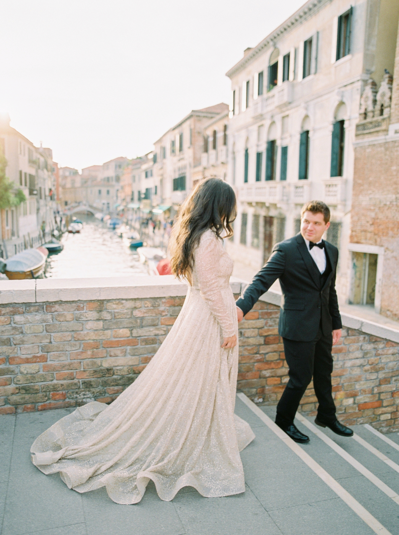 Venice italy wedding photographers | long sleeve wedding dress | italy vow renewal | justine milton fine art film photographer | bride and groom portraits in venice canals