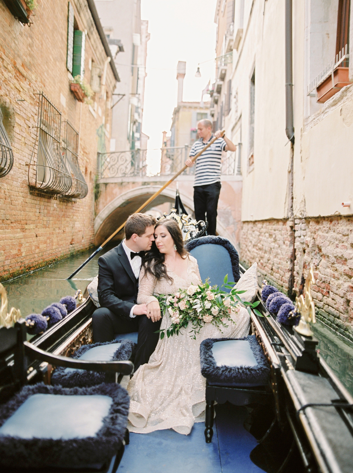 Venice italy wedding photographers | long sleeve wedding dress | italy vow renewal | justine milton fine art film photographer | bride and groom portraits in a gondola