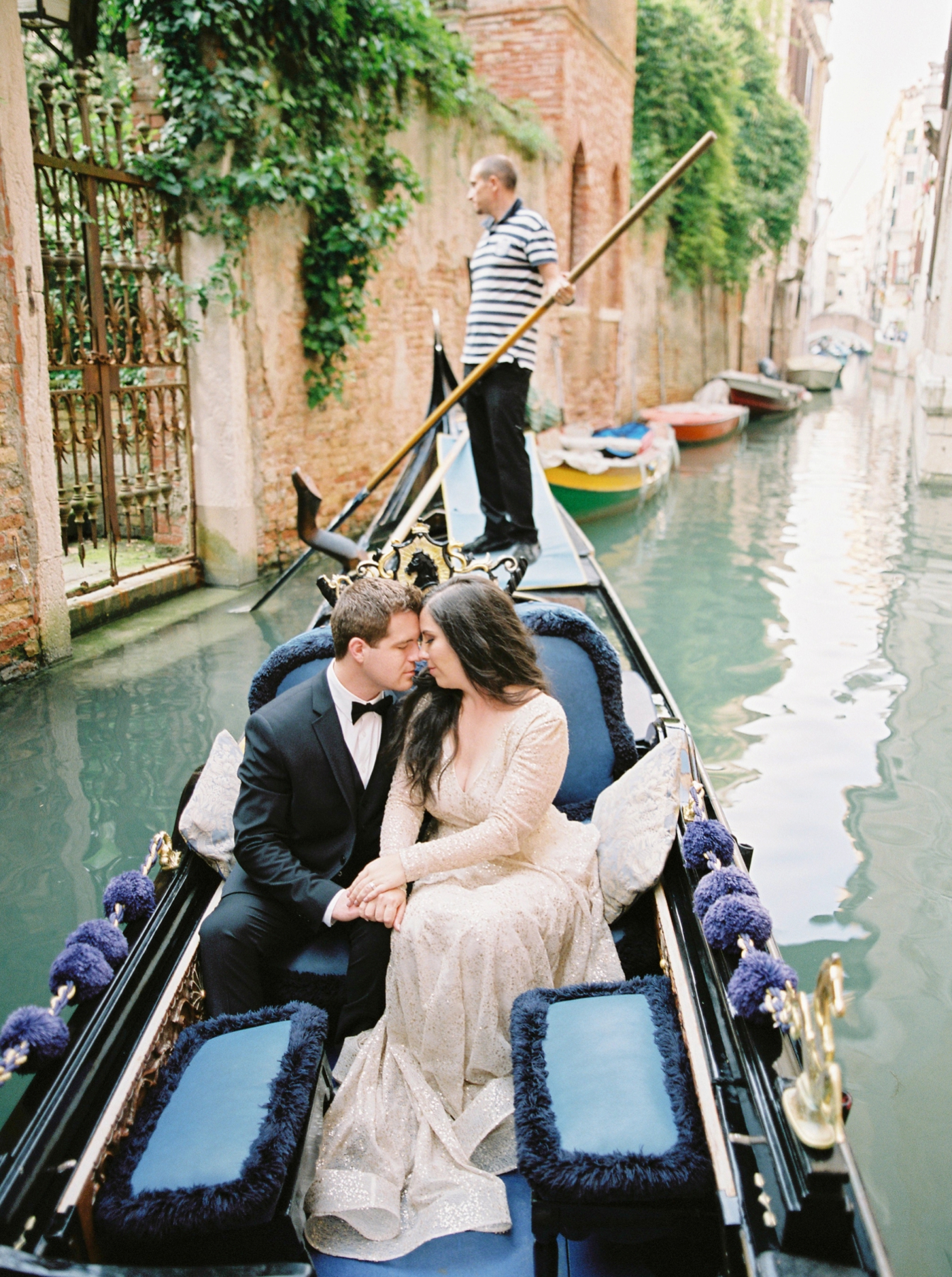 Venice italy wedding photographers | long sleeve wedding dress | italy vow renewal | justine milton fine art film photographer | bride and groom portraits in a gondola