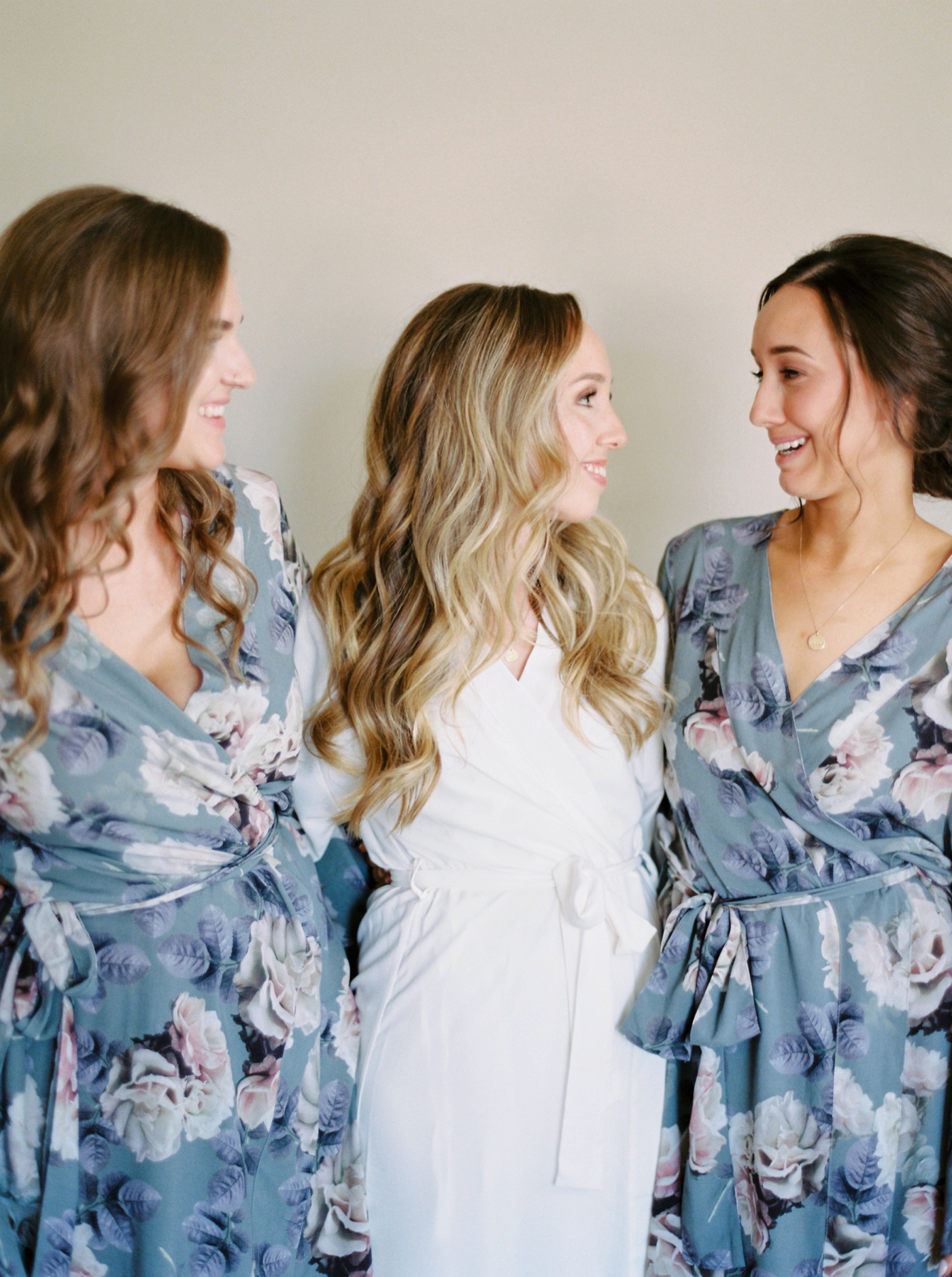 Calgary wedding photographers | The Gathered Farm Wedding | Justine milton fine art film photographer | bride getting ready bridesmaids robes