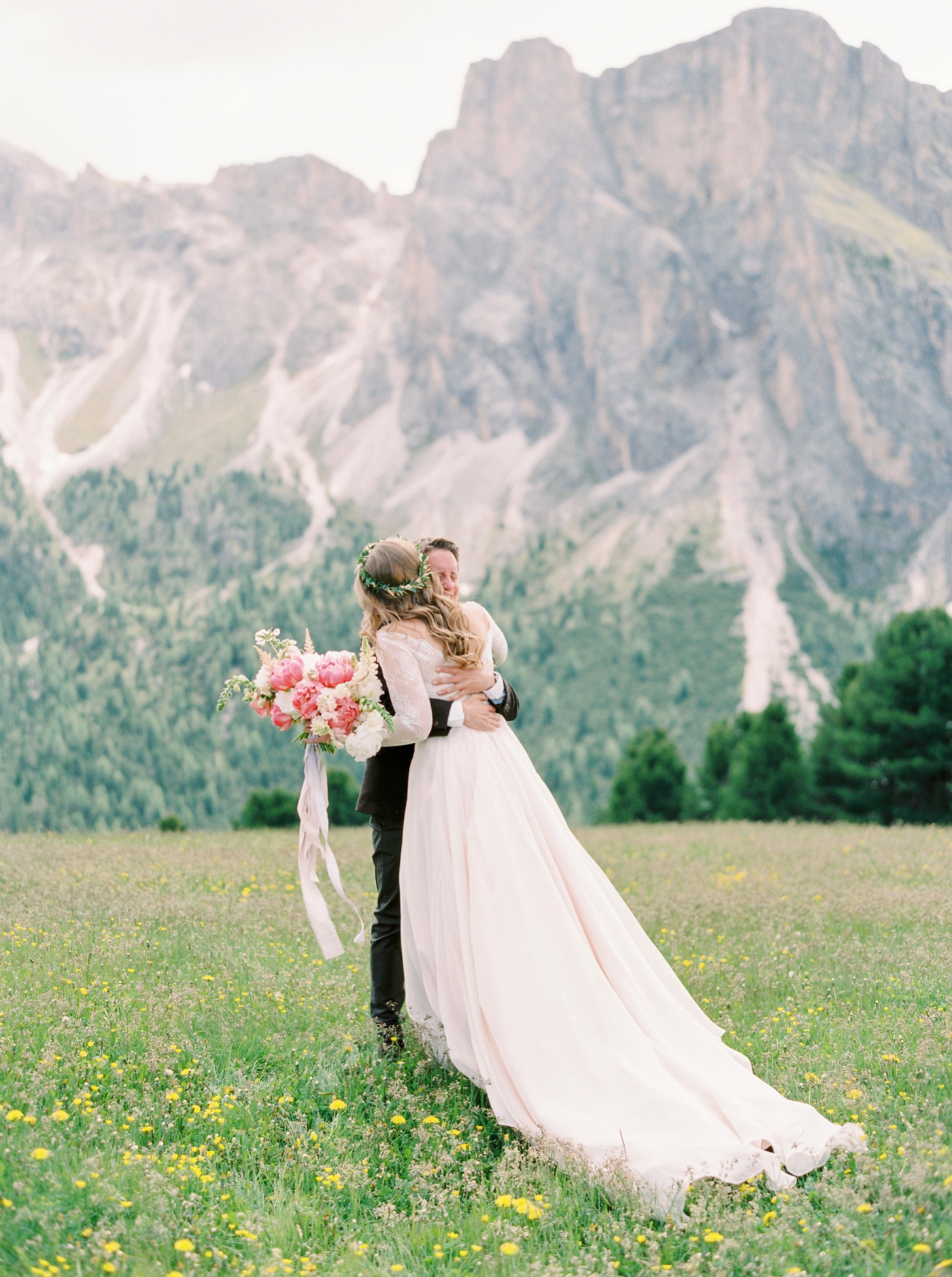Italy wedding photographers | Dolomites mountain top wedding | pink and white peony bouquet | long sleeve flowing wedding dress | Bride and groom portrait first look | justine milton fine art film ...
