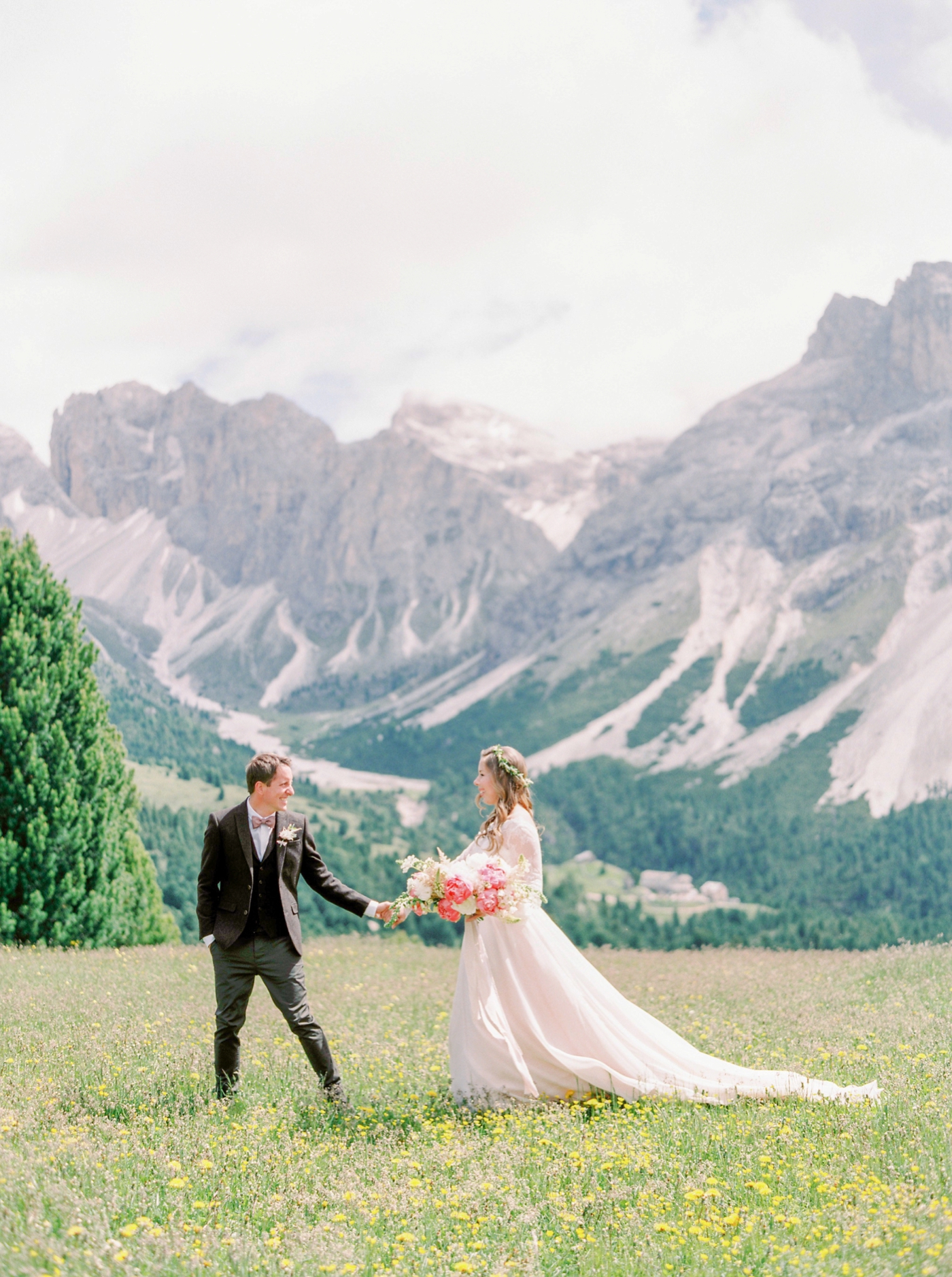 Italy wedding photographers | Dolomites mountain top wedding | pink and white peony bouquet | long sleeve flowing wedding dress | Bride and groom portrait first look | justine milton fine art film ...