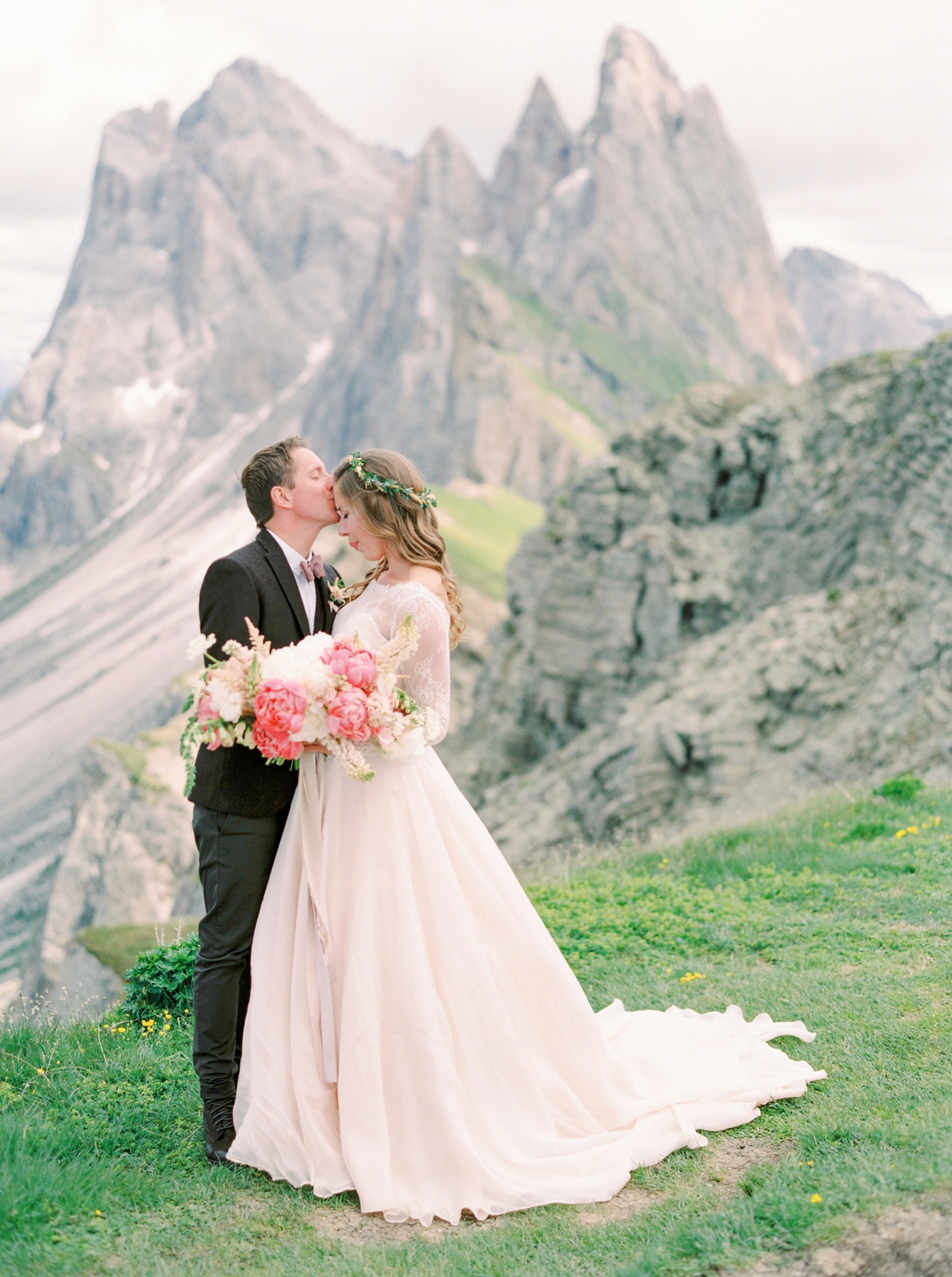 Italy wedding photographers | Dolomites mountain top wedding | pink and white peony bouquet | long sleeve flowing wedding dress | Bride and groom portrait | justine milton fine art film photographers
