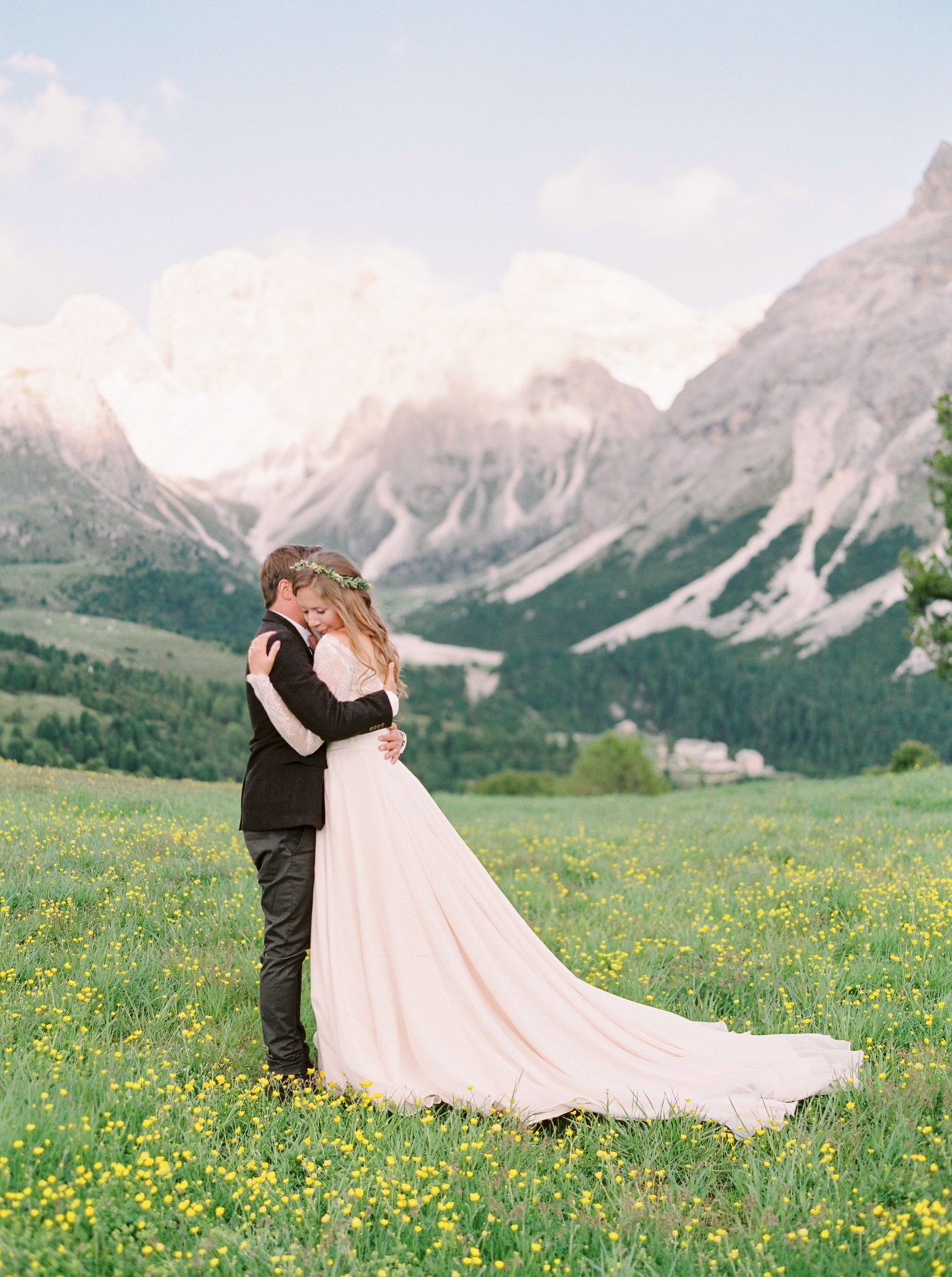 Italy wedding photographers | Dolomites mountain top wedding | pink and white peony bouquet | long sleeve flowing wedding dress | Bride and groom portrait | justine milton fine art film photographers