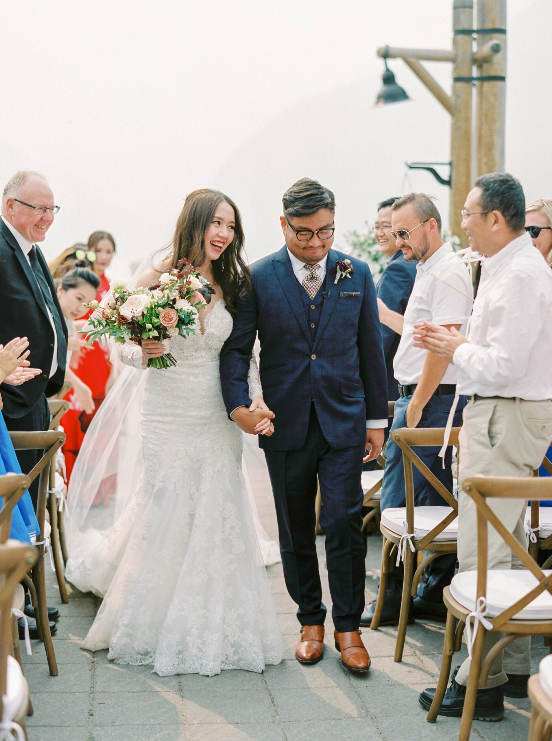  Lake Louise wedding photographers | Justine milton photography | fine art film destination wedding photographer | wedding ceremony bride and groom walk down the aisle 