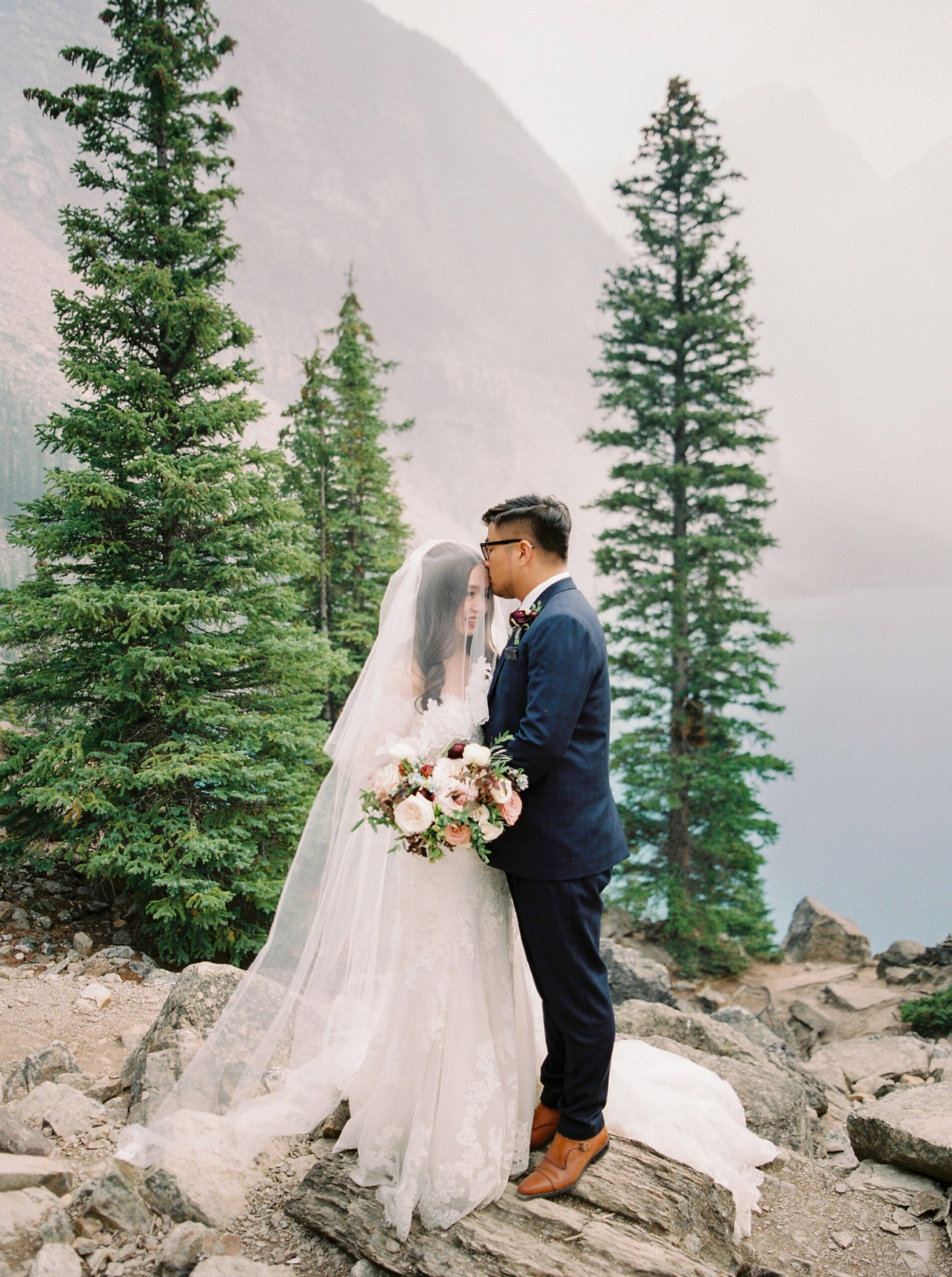  Lake Louise wedding photographers | Justine milton photography | fine art film destination wedding photographer | fairmont chateau lake louise bride and groom portrait 