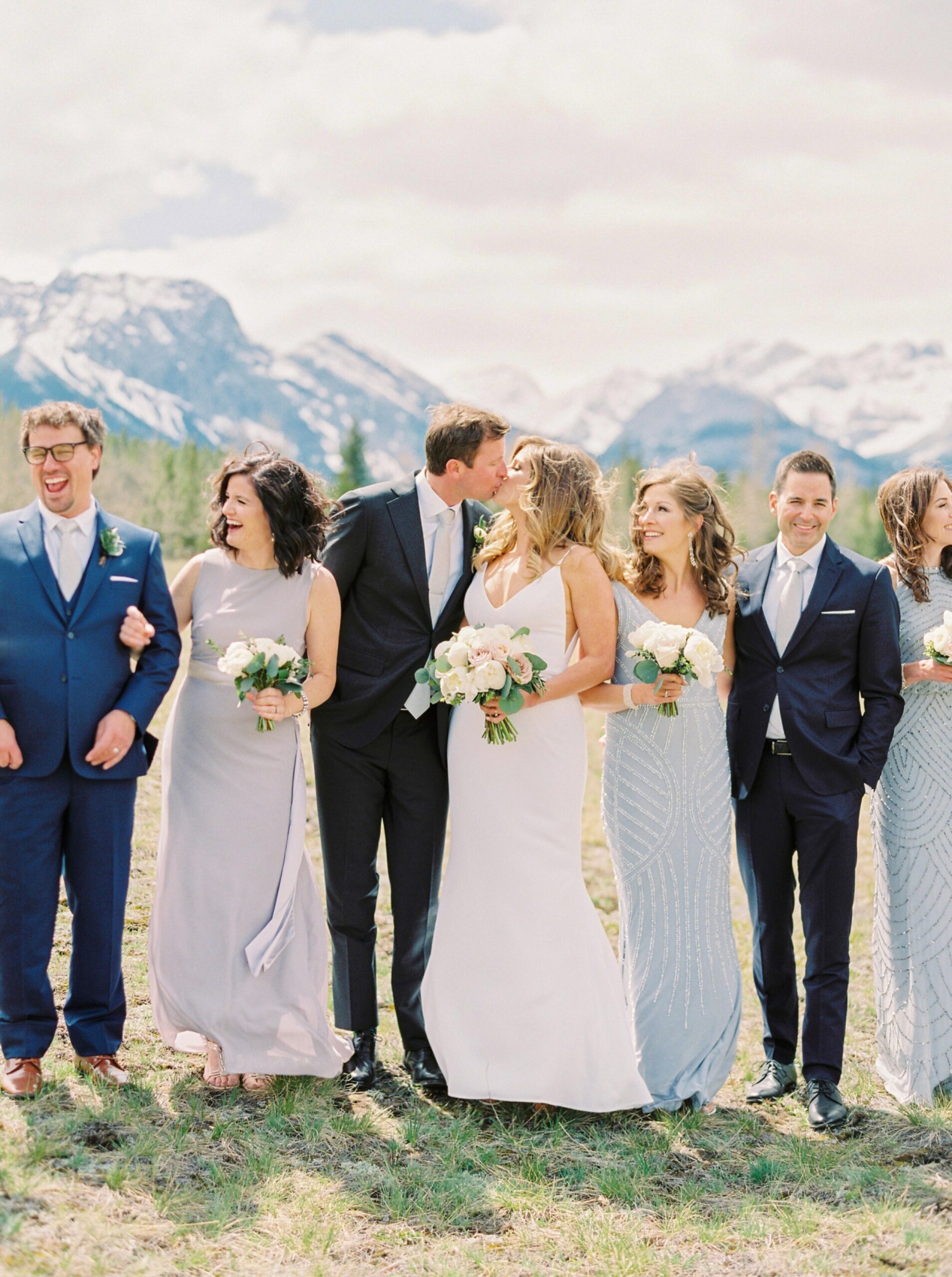  bridesmaids pose ideas in mixmatched glue grey purple beaded dresses | Kananaskis wedding | fine art film Banff wedding photographer 