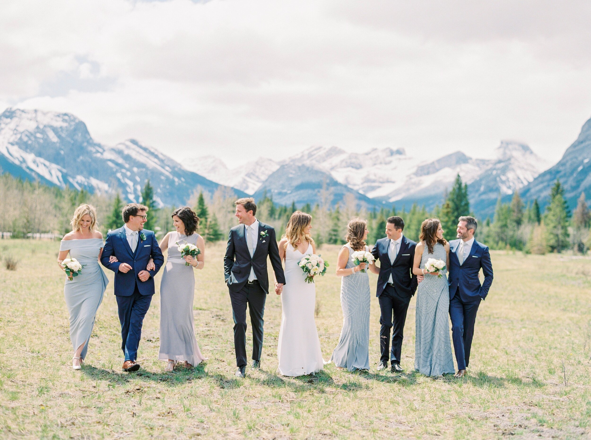  bridesmaids pose ideas in mixmatched glue grey purple beaded dresses | Kananaskis wedding | fine art film Banff wedding photographer 