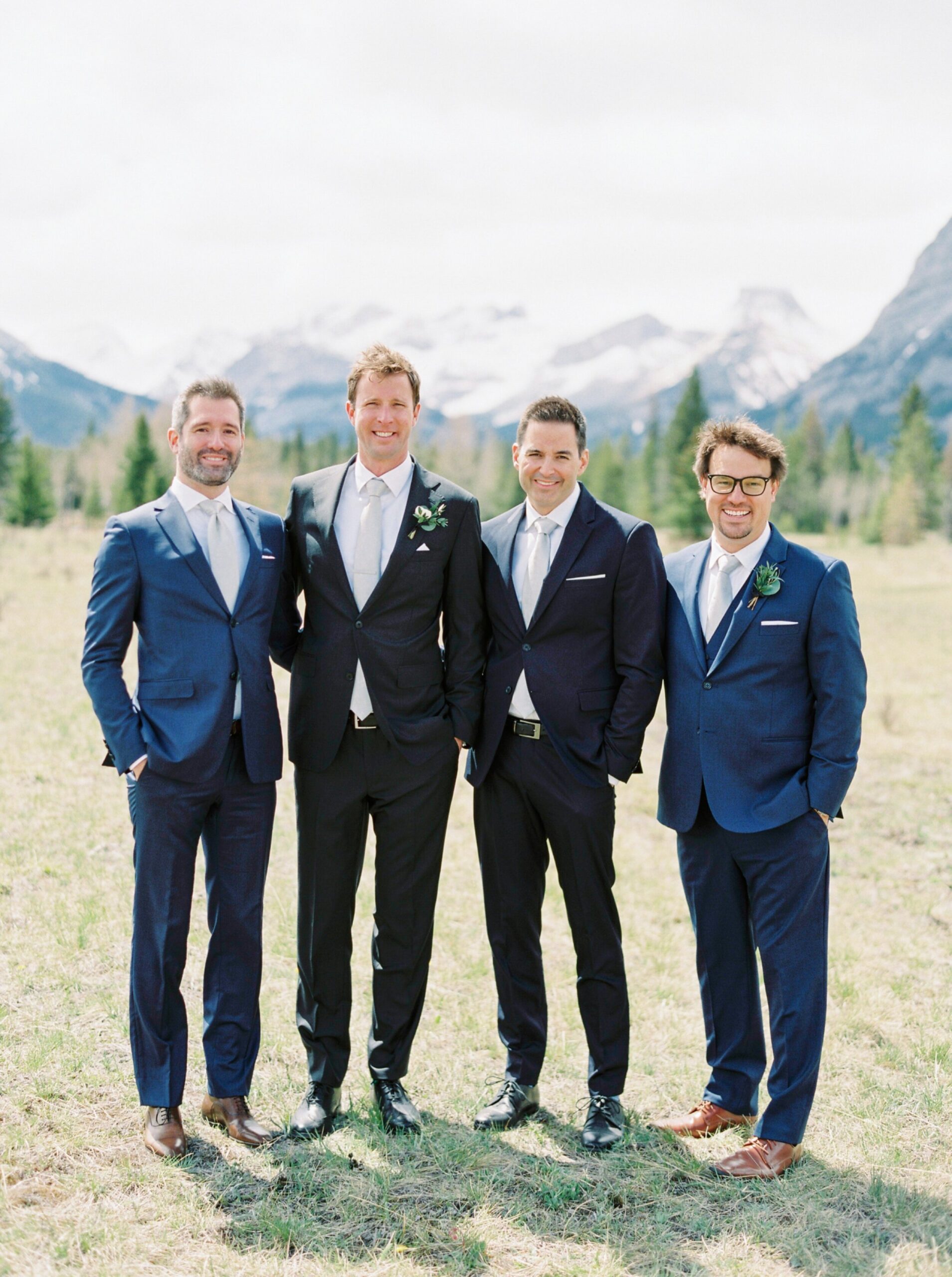  groomsmen in mixmatched blue suits | Kananaskis wedding | fine art film Banff wedding photographer 