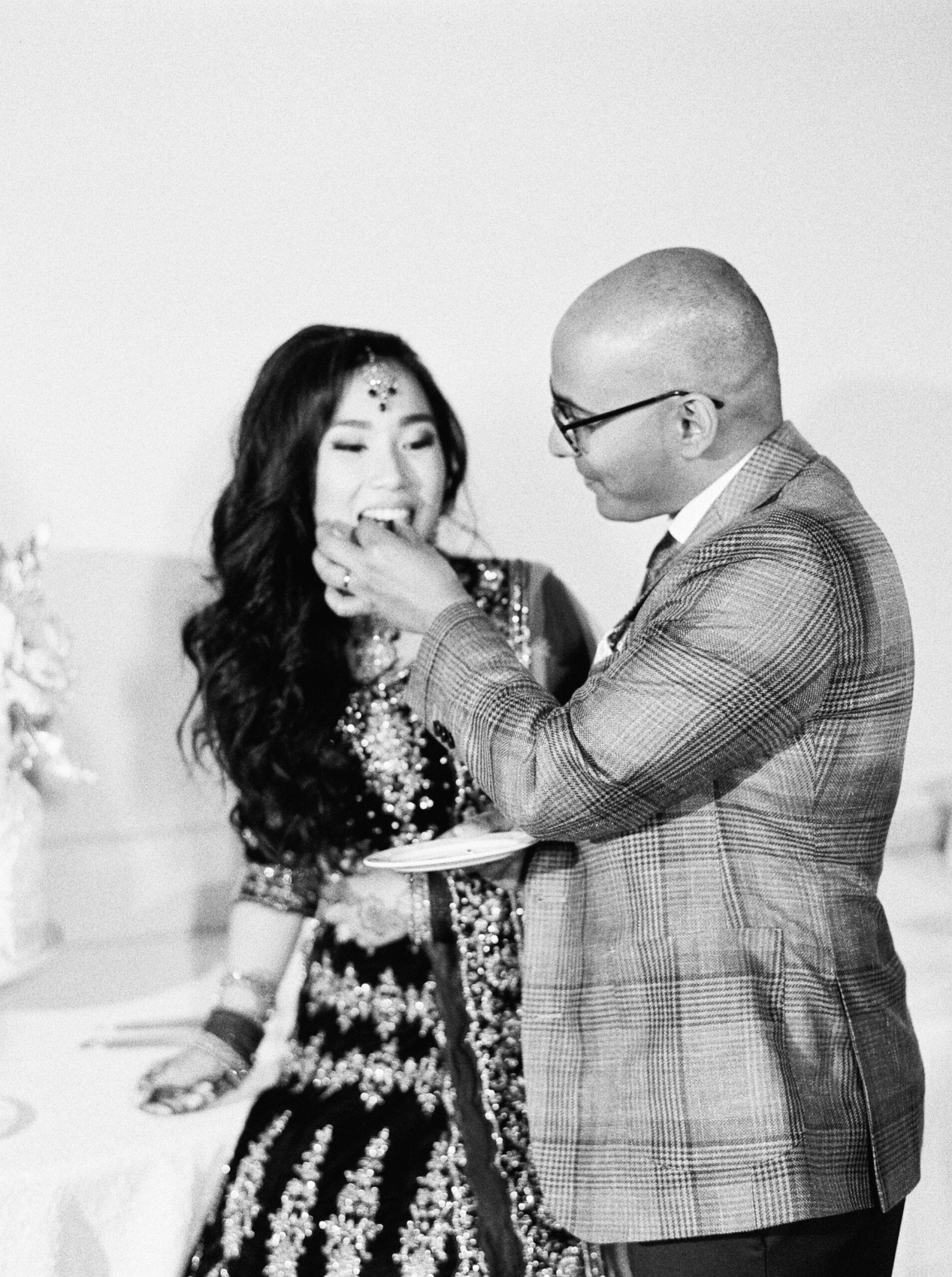  Cake cutting on black and white film | Indian Chinese Fusion Wedding | Calgary wedding photographers 
