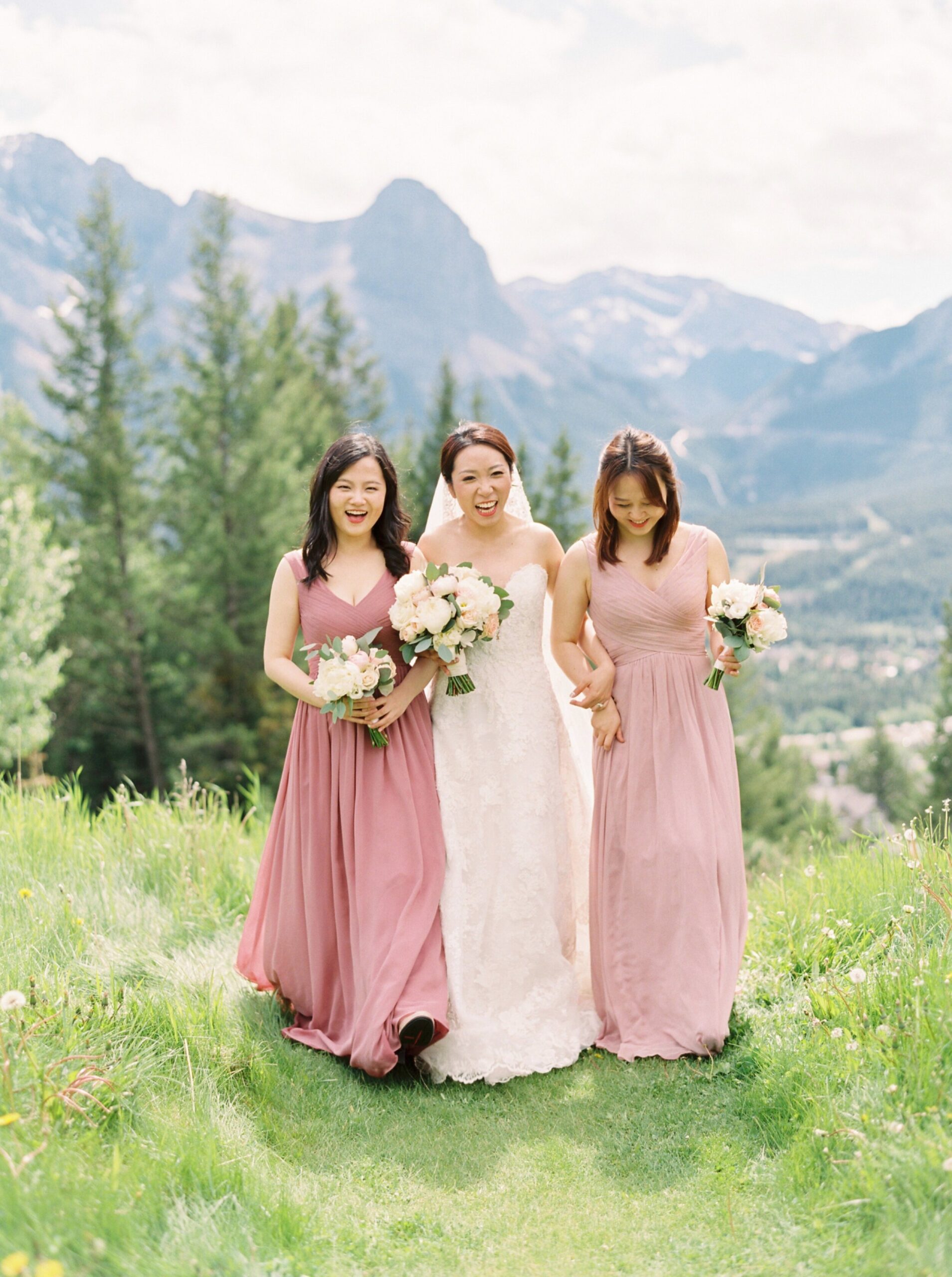  wedding party with mix matched blush pink dresses and navy suits and vests | silvertip canmore wedding photographers 