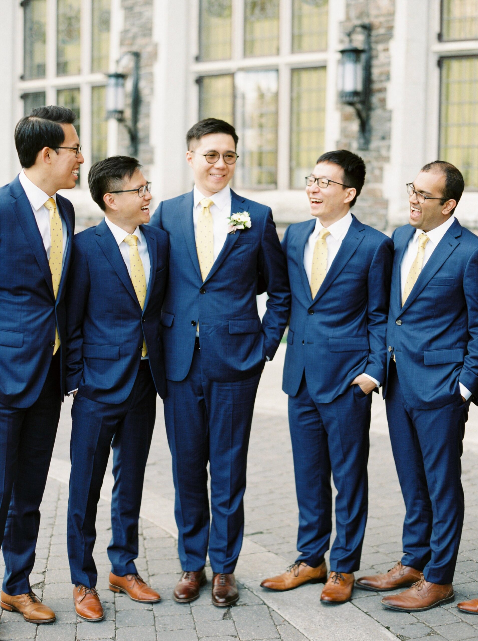 Groomsmesn in Navy blue suits and yellow ties | Fairmont Banff Springs hotel wedding photographers | fine art film photography | portra 400 