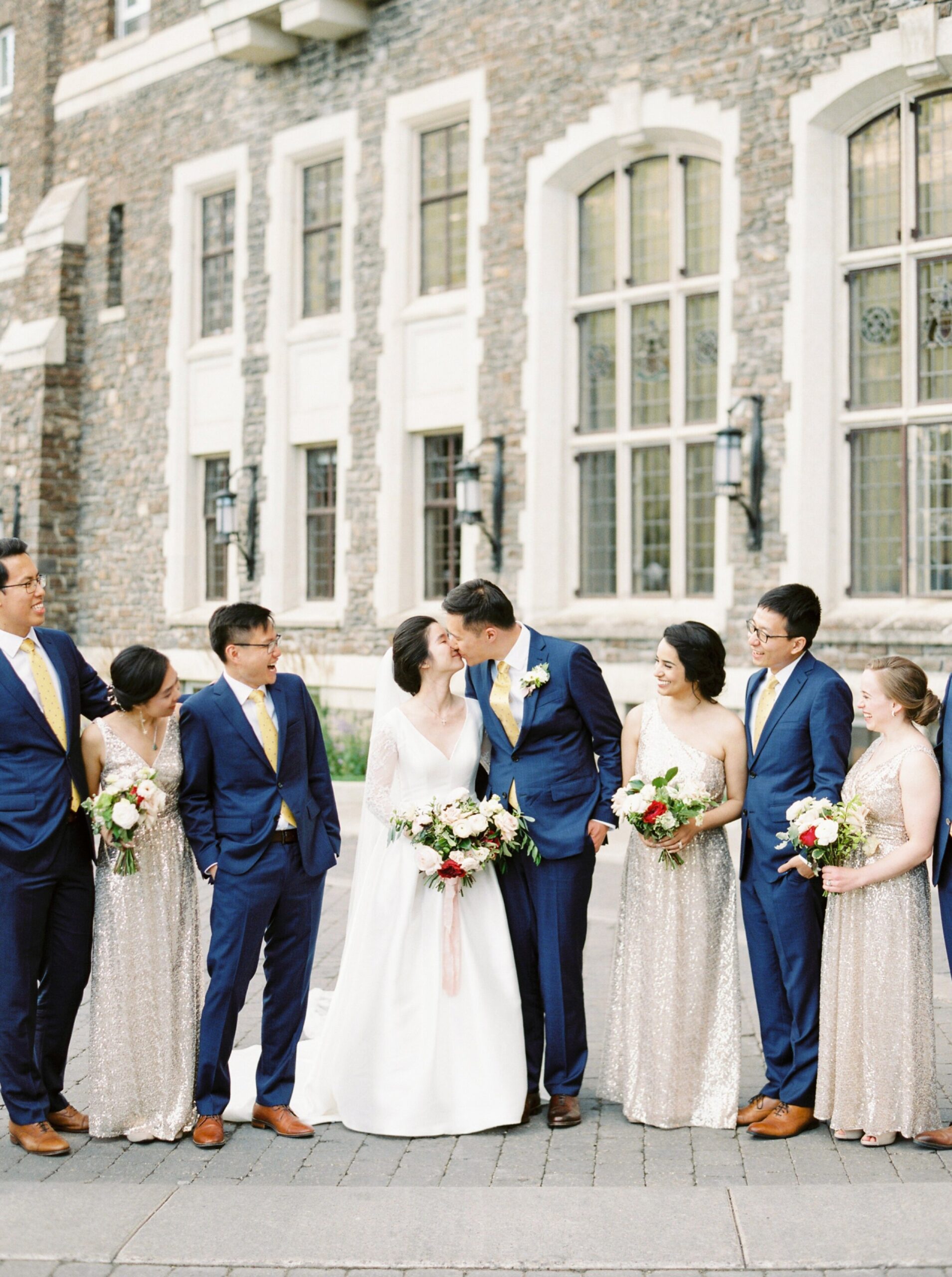  bridesmaids in gold maxi dress | Groomsmesn in Navy blue suits and yellow ties | Fairmont Banff Springs hotel wedding photographers | fine art film photography | portra 400 