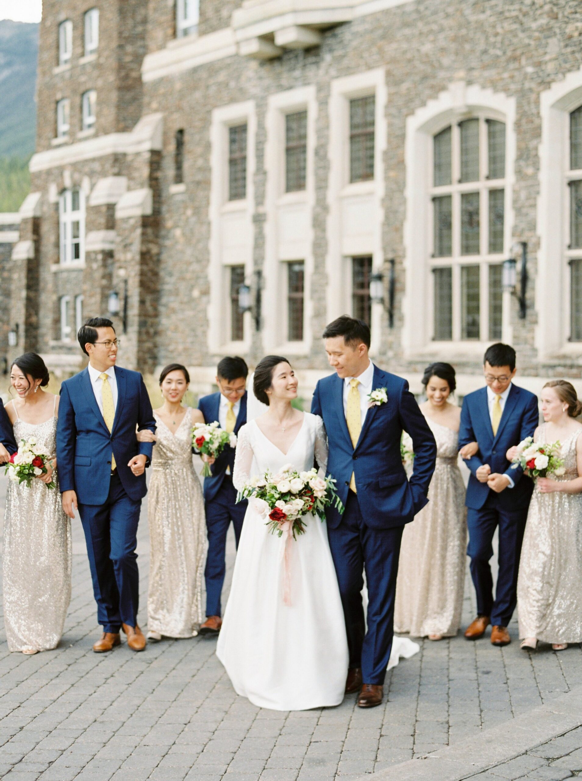  bridesmaids in gold maxi dress | Groomsmesn in Navy blue suits and yellow ties | Fairmont Banff Springs hotel wedding photographers | fine art film photography | portra 400 