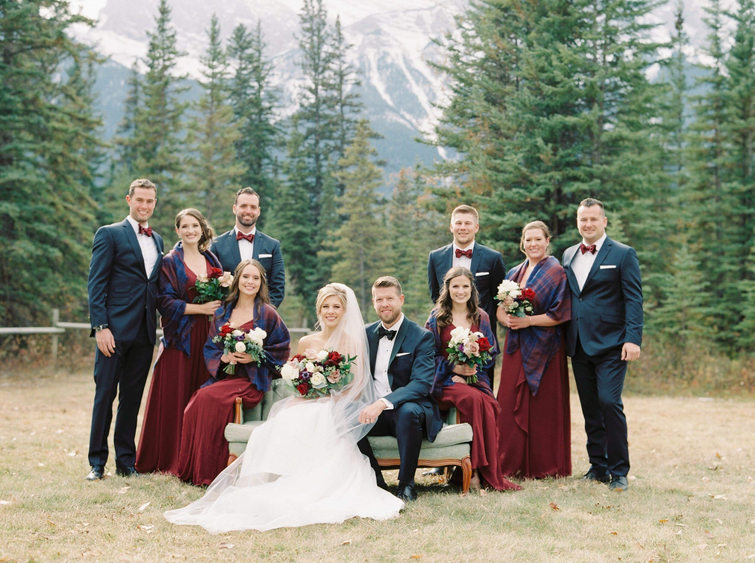  Bridesmaids in red dresses and plaid shawls for fall mountain wedding | Cornerstone Theater & Canmore Ranch Wedding Photographers 