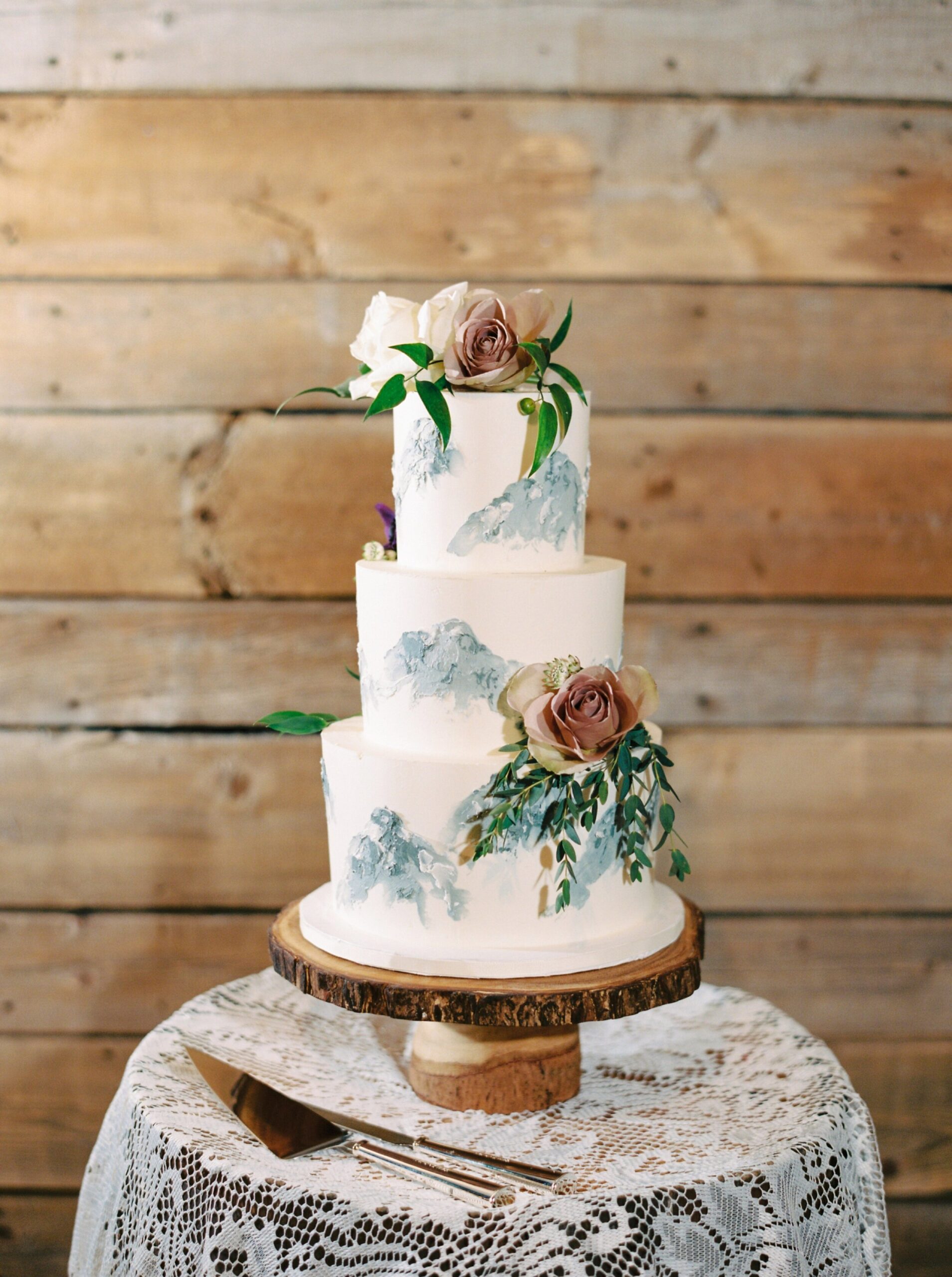  hand painted tiered wedding cake with mountains | Cornerstone Theater & Canmore Ranch Wedding Photographers 