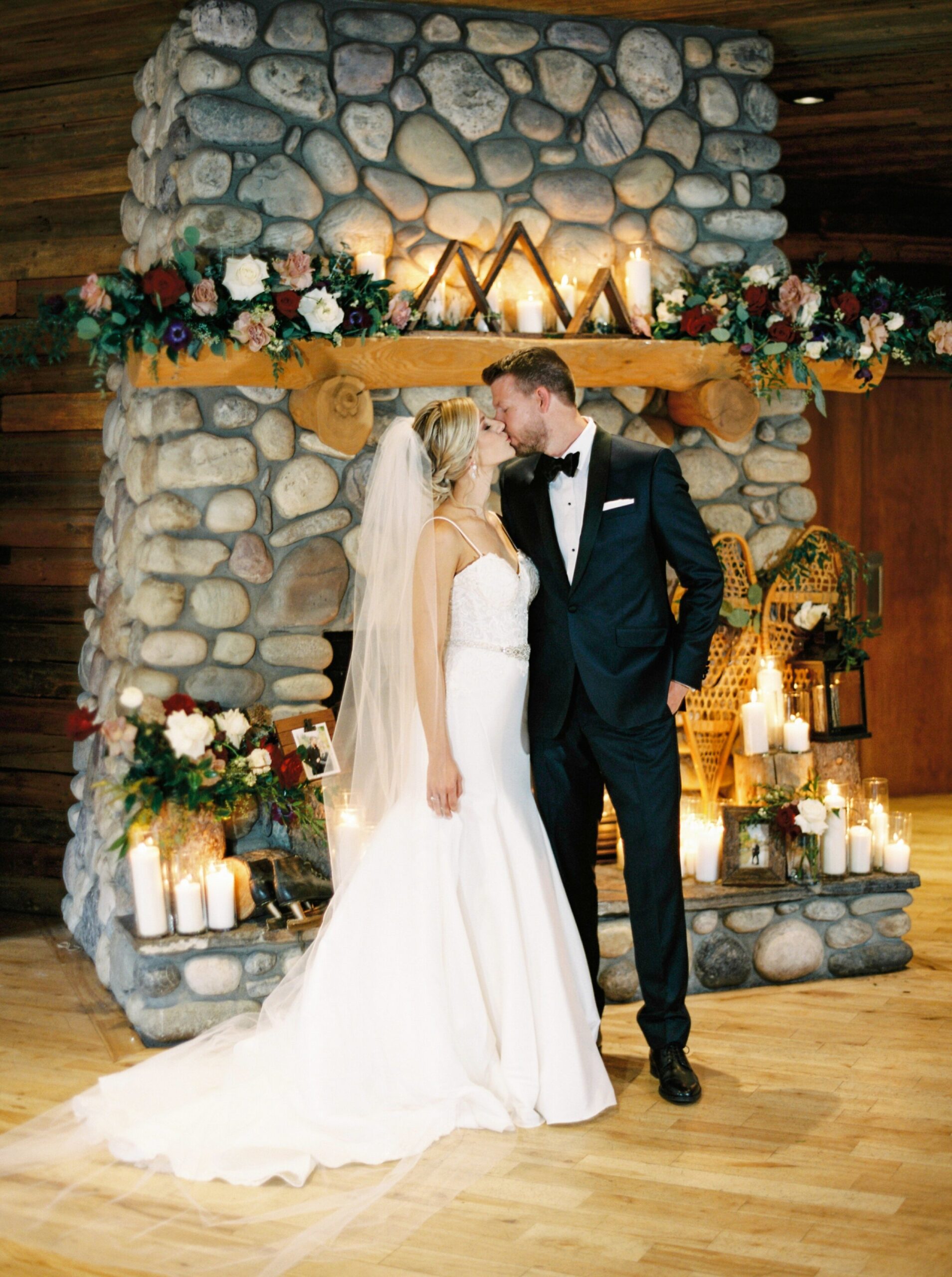  bride and groom in front of fireplace | Cornerstone Theater & Canmore Ranch Wedding Photographers 