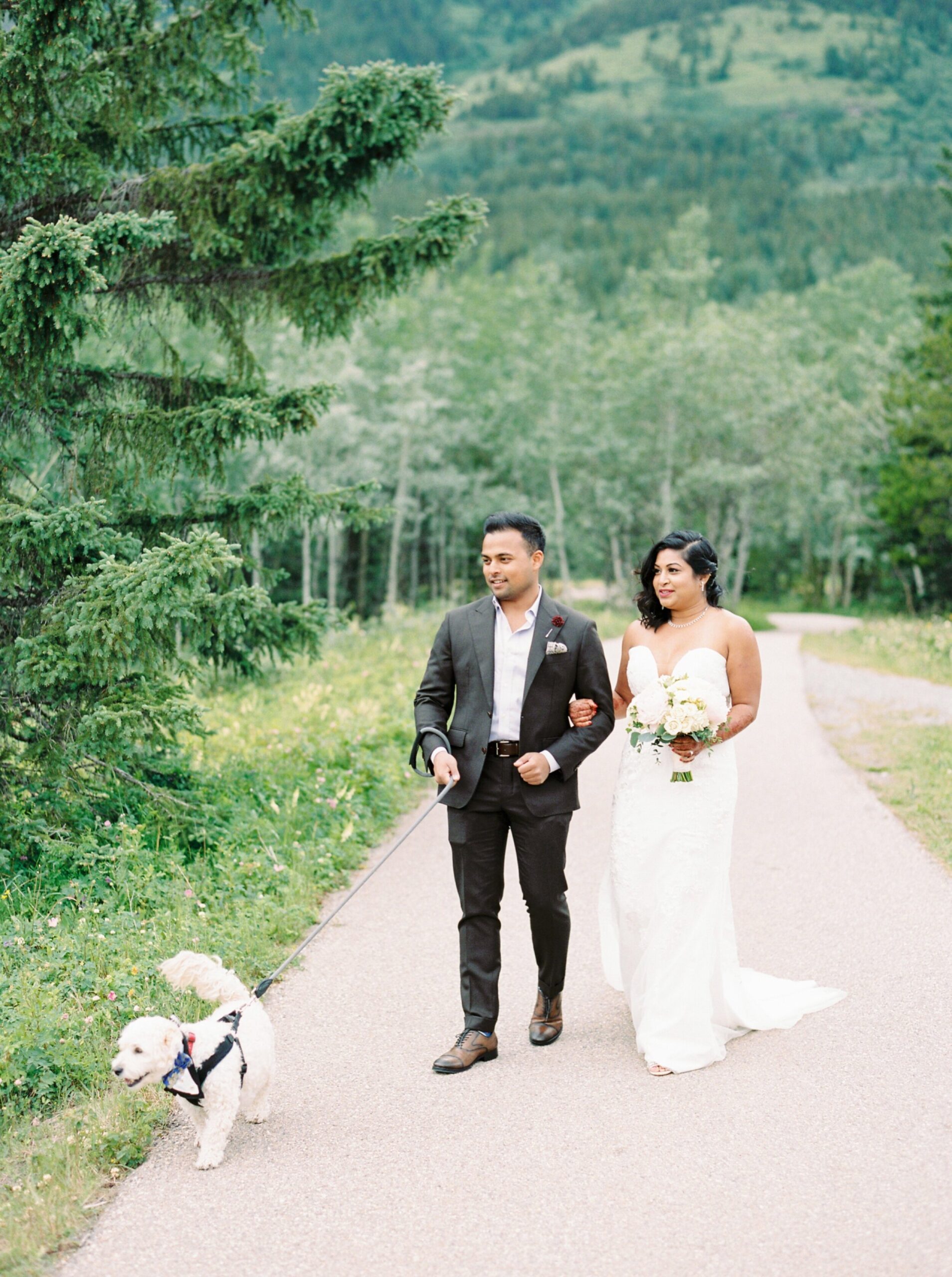  mini ceremony brides and groom navy suit and minimal form fitting dress | Kananaskis micro wedding elopement in the mountains 