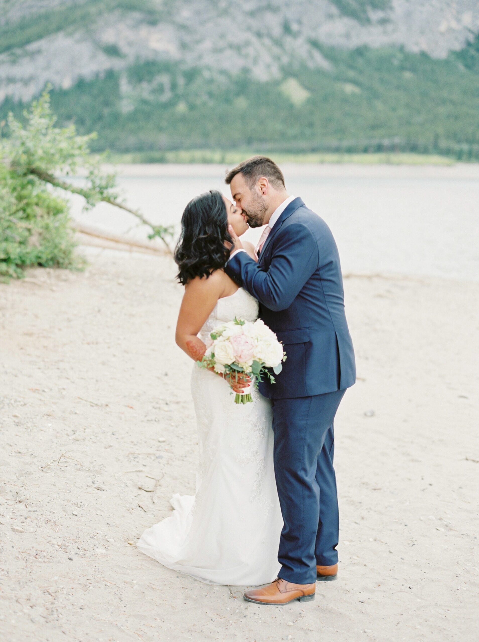  mini ceremony brides and groom navy suit and minimal form fitting dress | Kananaskis micro wedding elopement in the mountains 