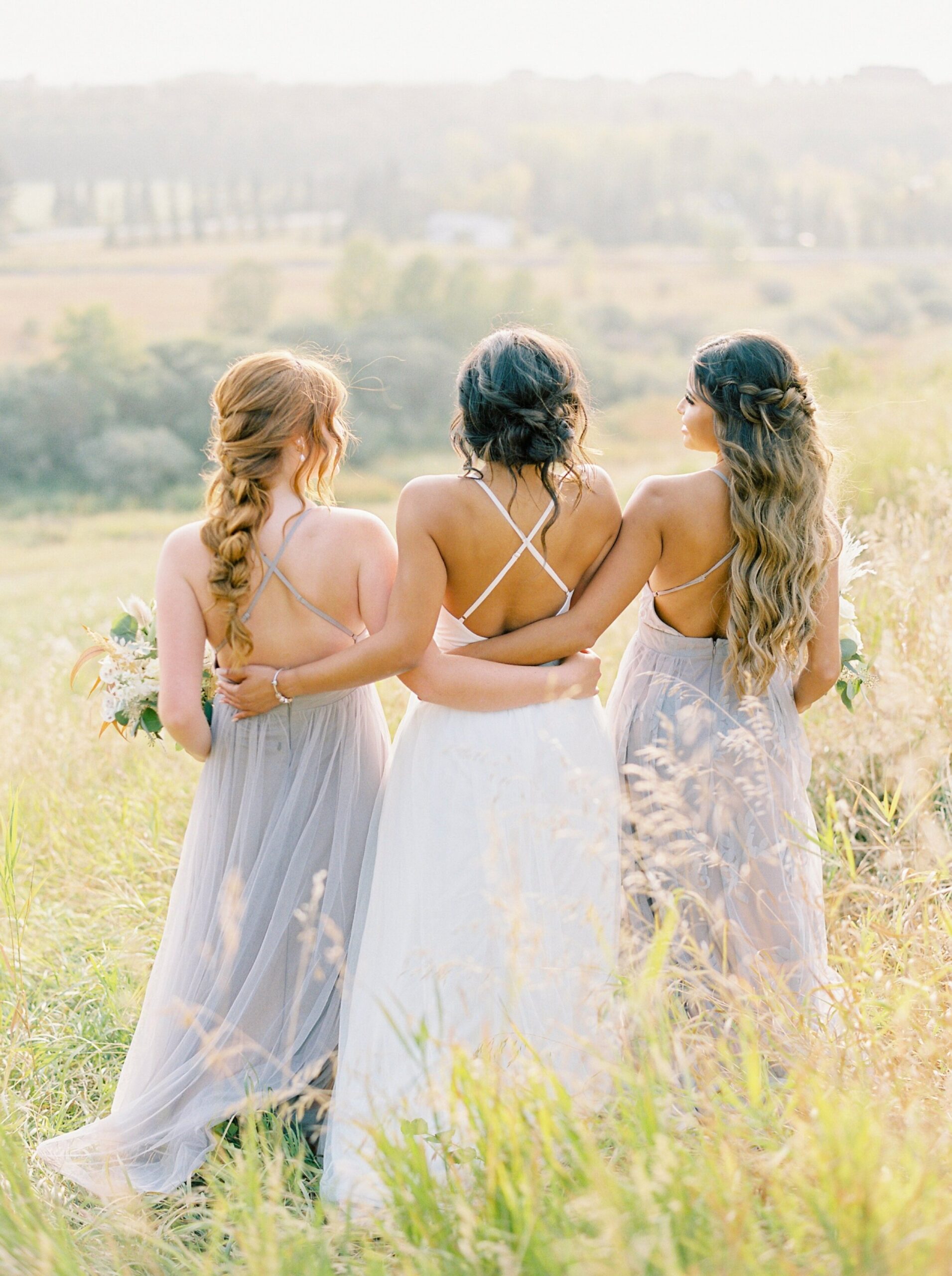 bride and bridesmaids in dusty purple lavender with boho florals | Rocky Mountain Bride Magazine Feature | The Rdige Okotoks Bridal Editorial | Boho hats | film photographer 