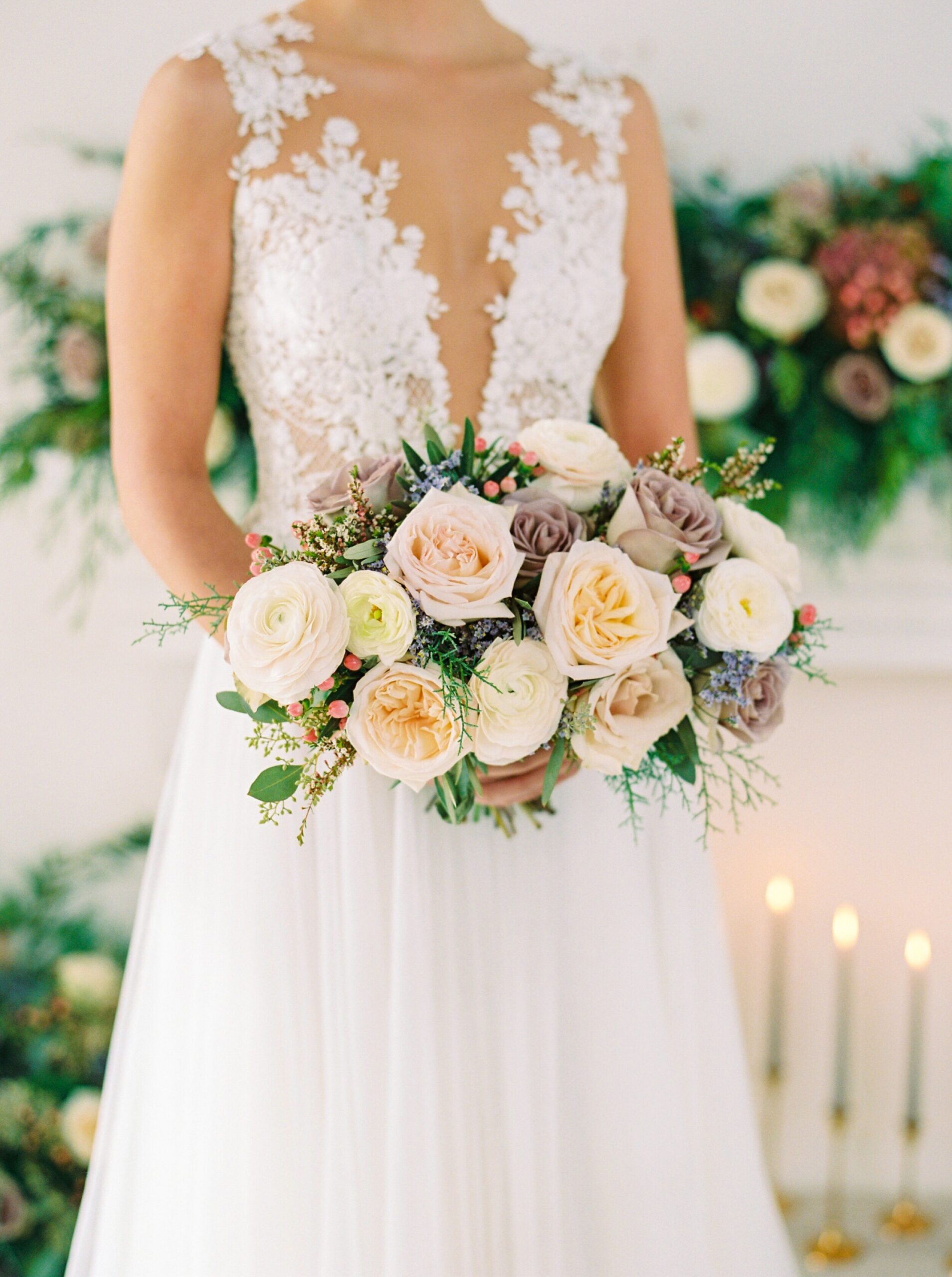  wedding dress inspiration | fine art flower installation with greenery above fireplace | modern bridal bouquet with dusty pinks and roses 