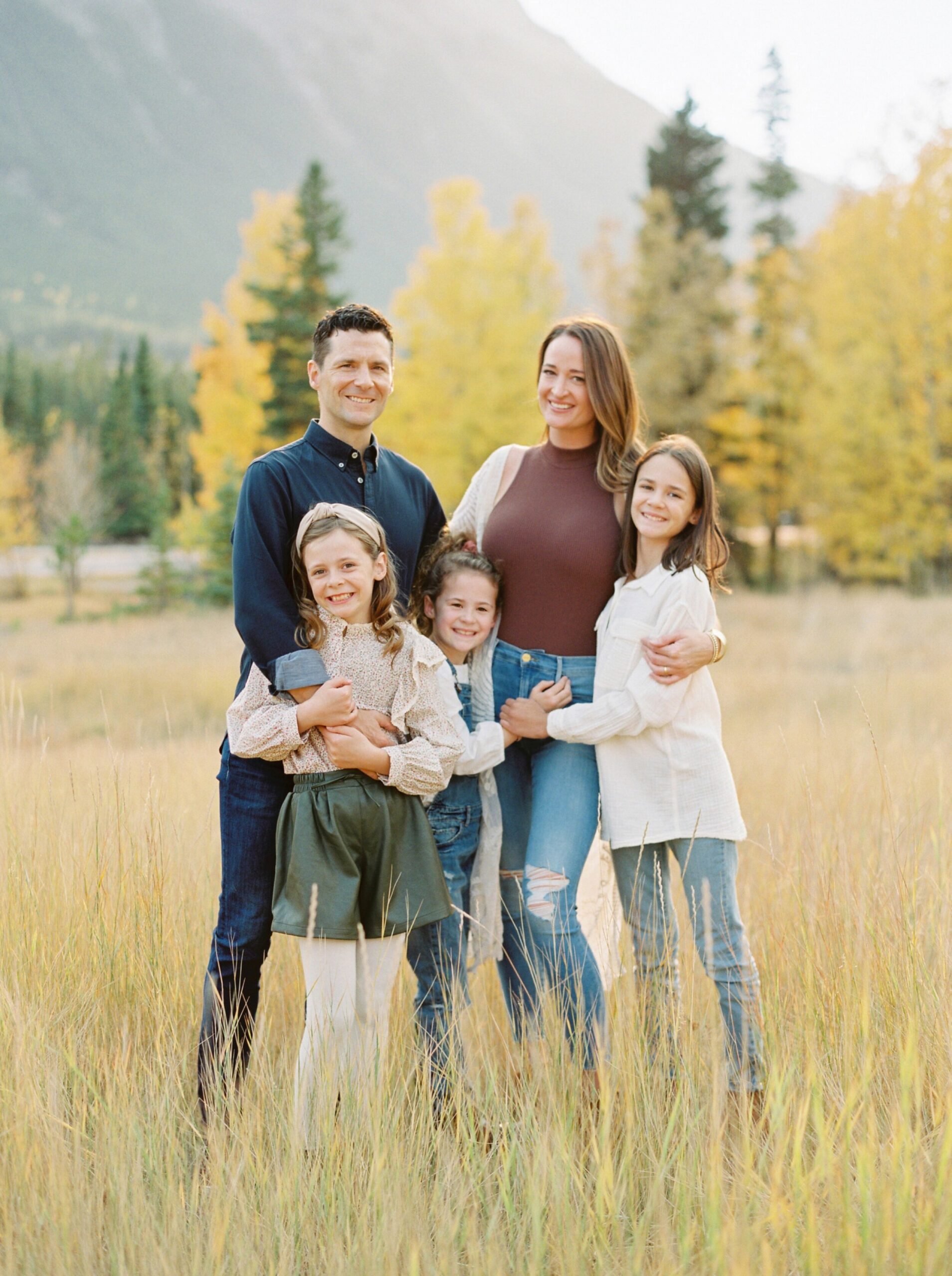  outfit inspiration for fall famliy portraits | Calgary fall family photographers | family photo session ideas and poses with older kids | film photographer Justine Milton 
