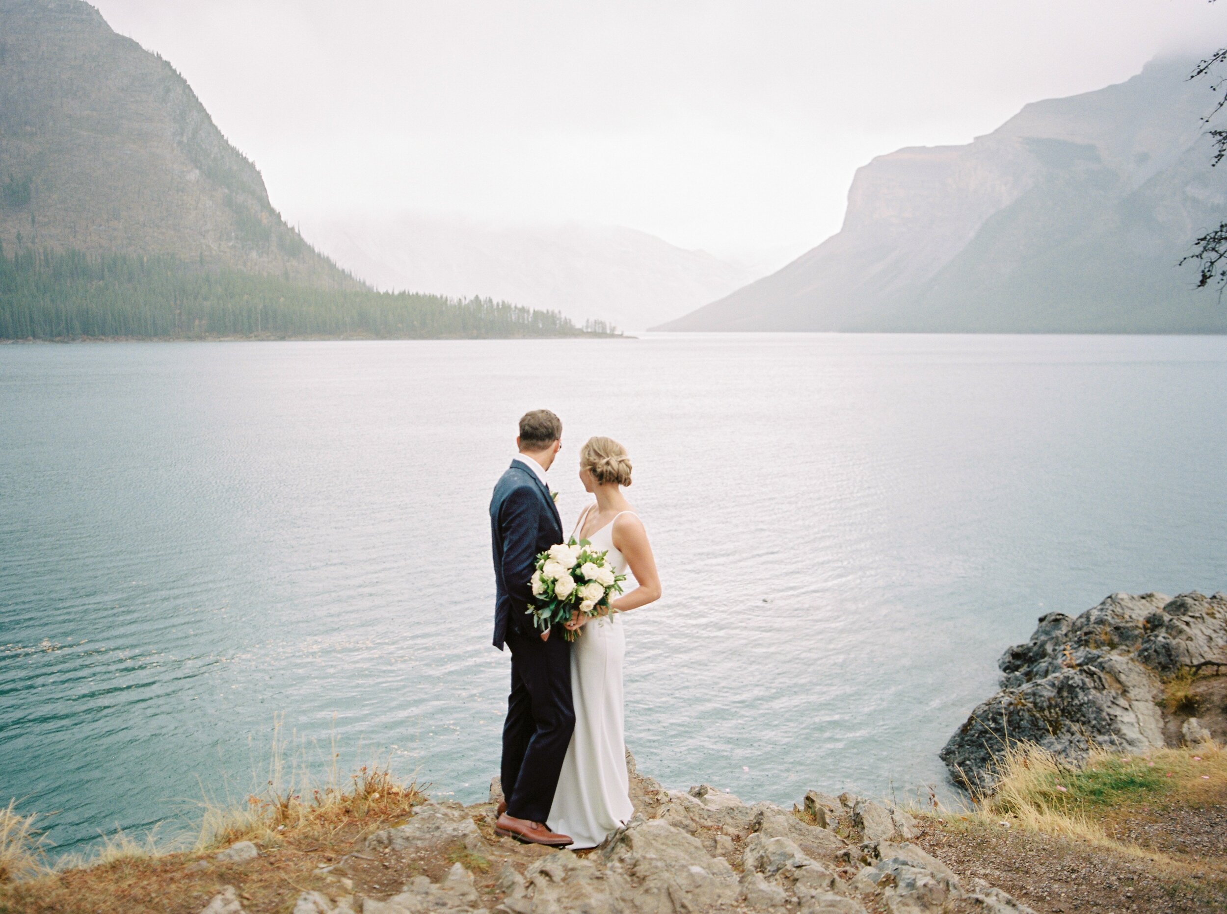  Bride and groom portraits in the pouring rain | Banff Springs Hotel Vow Renewal Wedding Photographers 