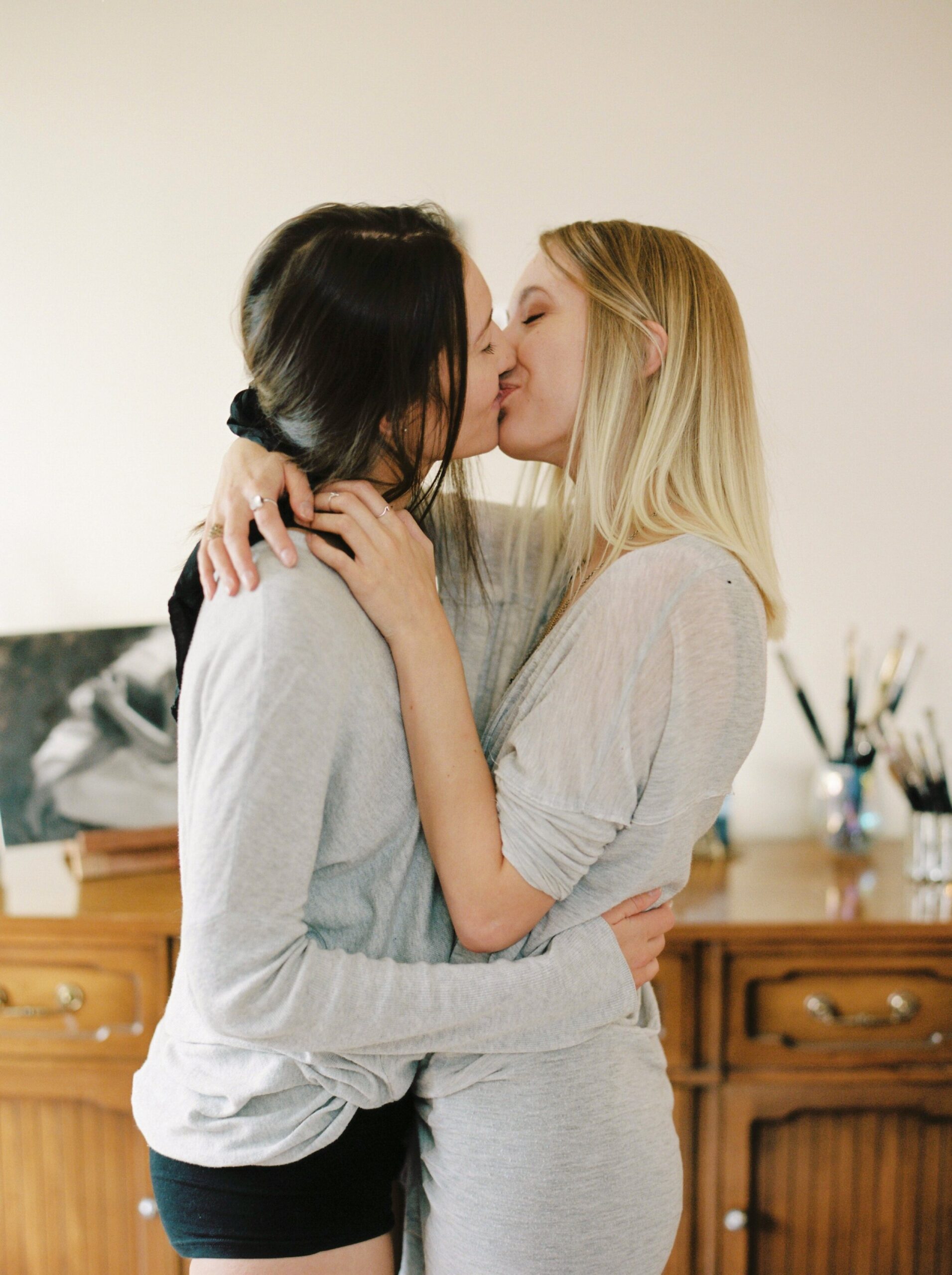  dark and moody film inspiration | same sex lesbian couple pose ideas | artists in love | lesbian in home engagement session 