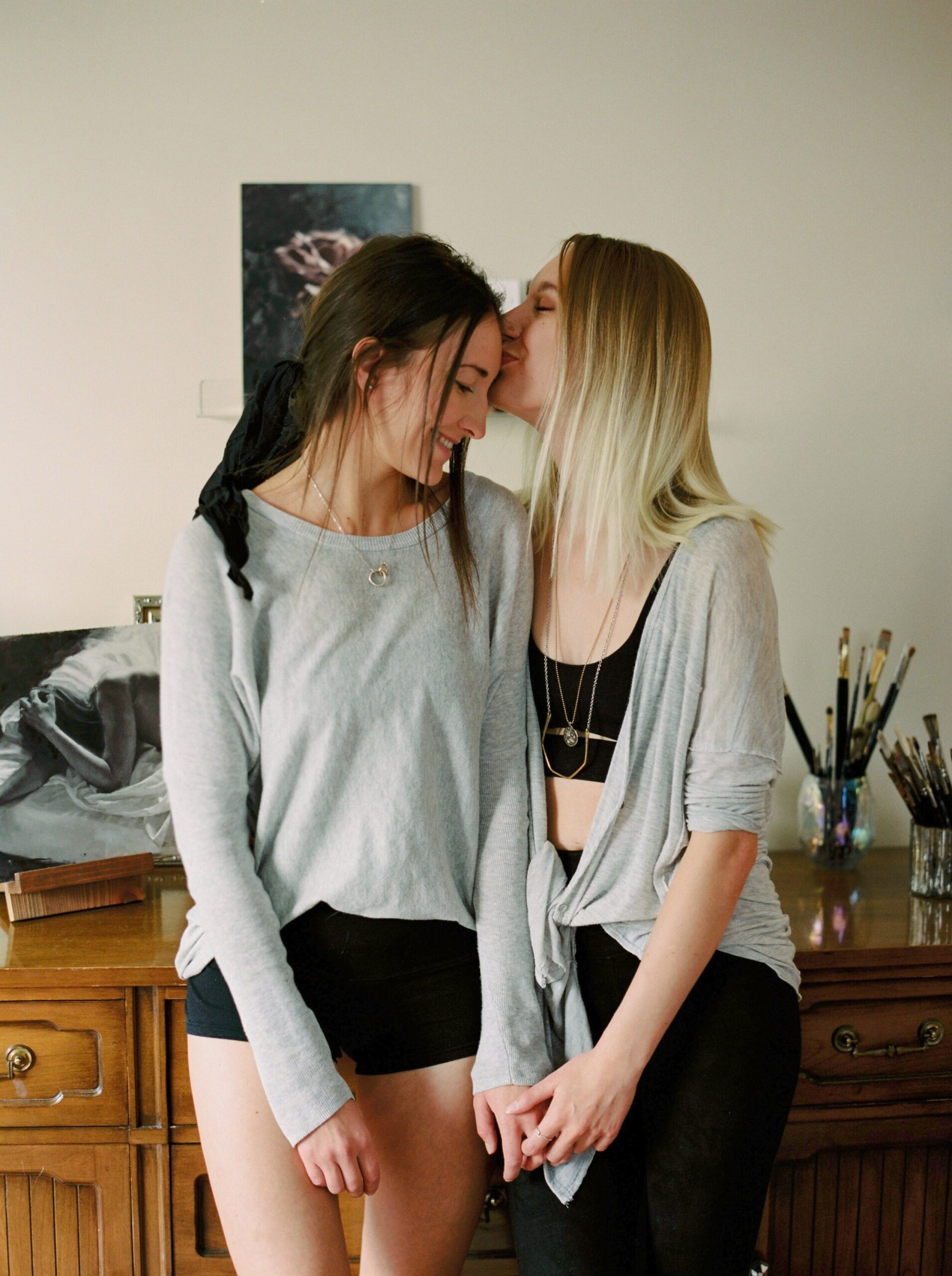  dark and moody film inspiration | same sex lesbian couple pose ideas | artists in love | lesbian in home engagement session 