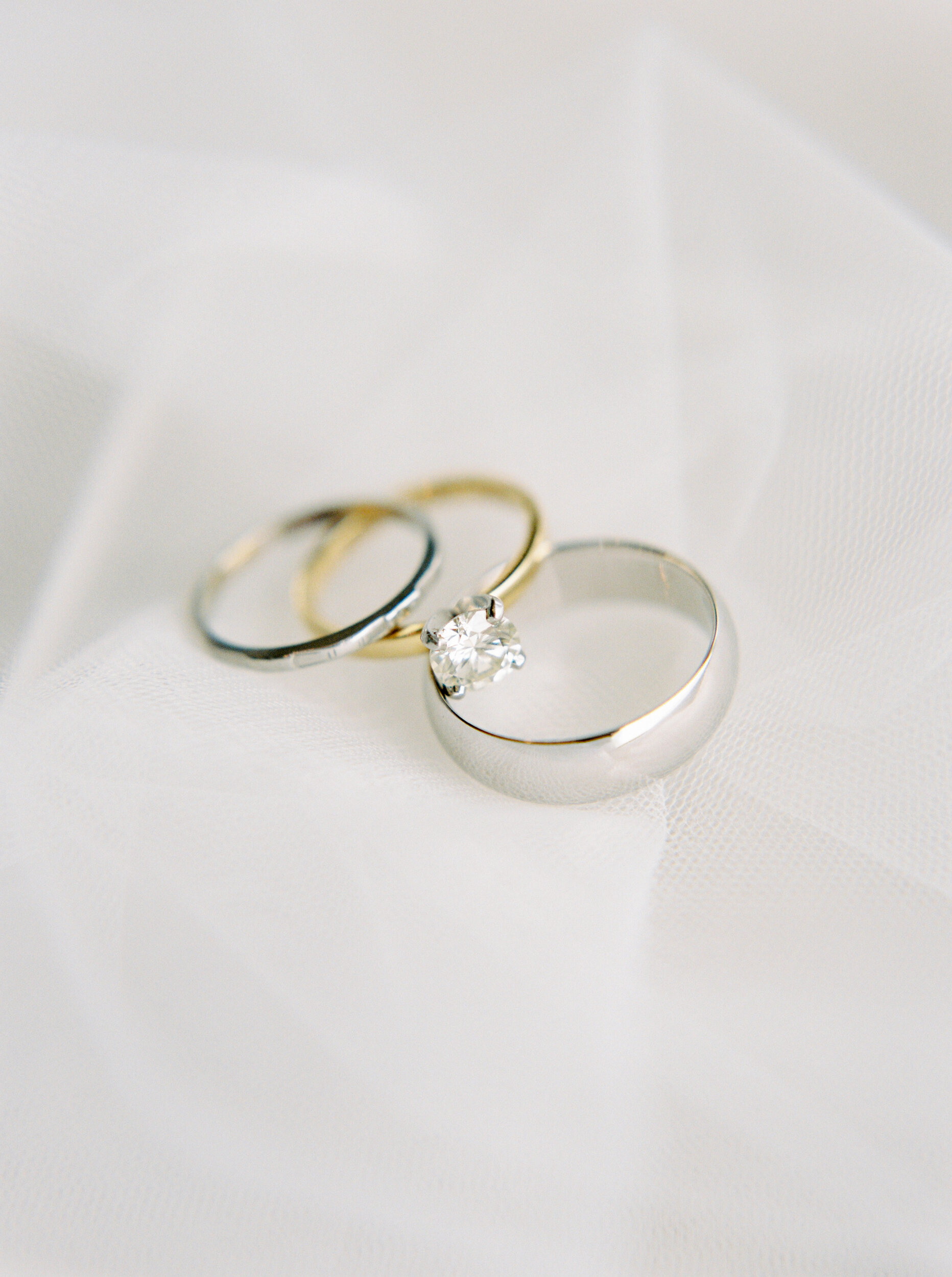  macro detail shot of wedding rings and diamond engagement ring | Kananaskis wedding | fine art film Banff wedding photographer 