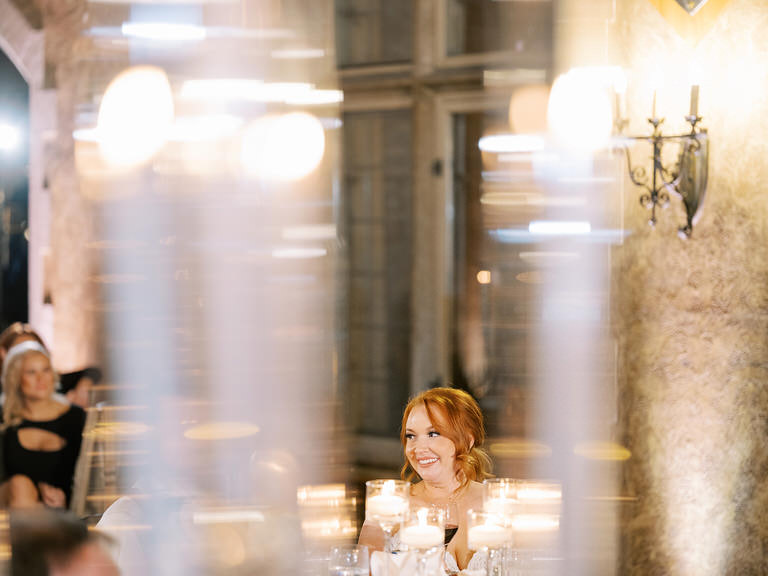 Editorial style photo of Bride smiling at wedding reception at Banff Springs Hotel 