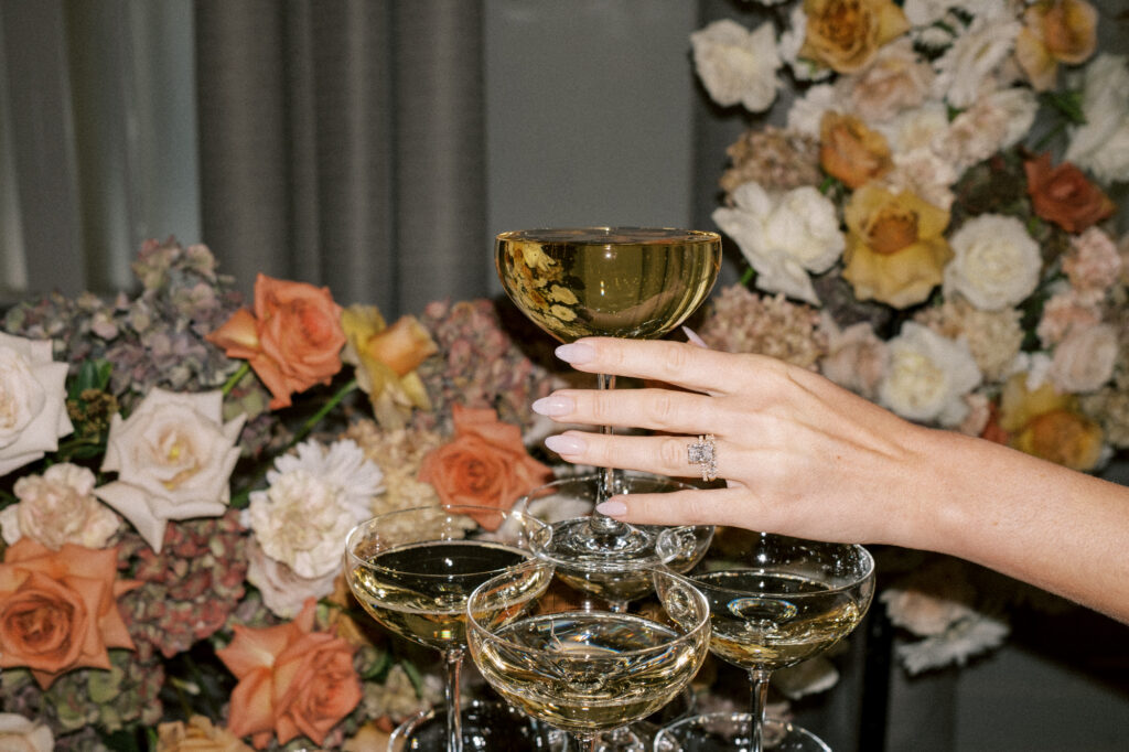 champagne and engagement ring