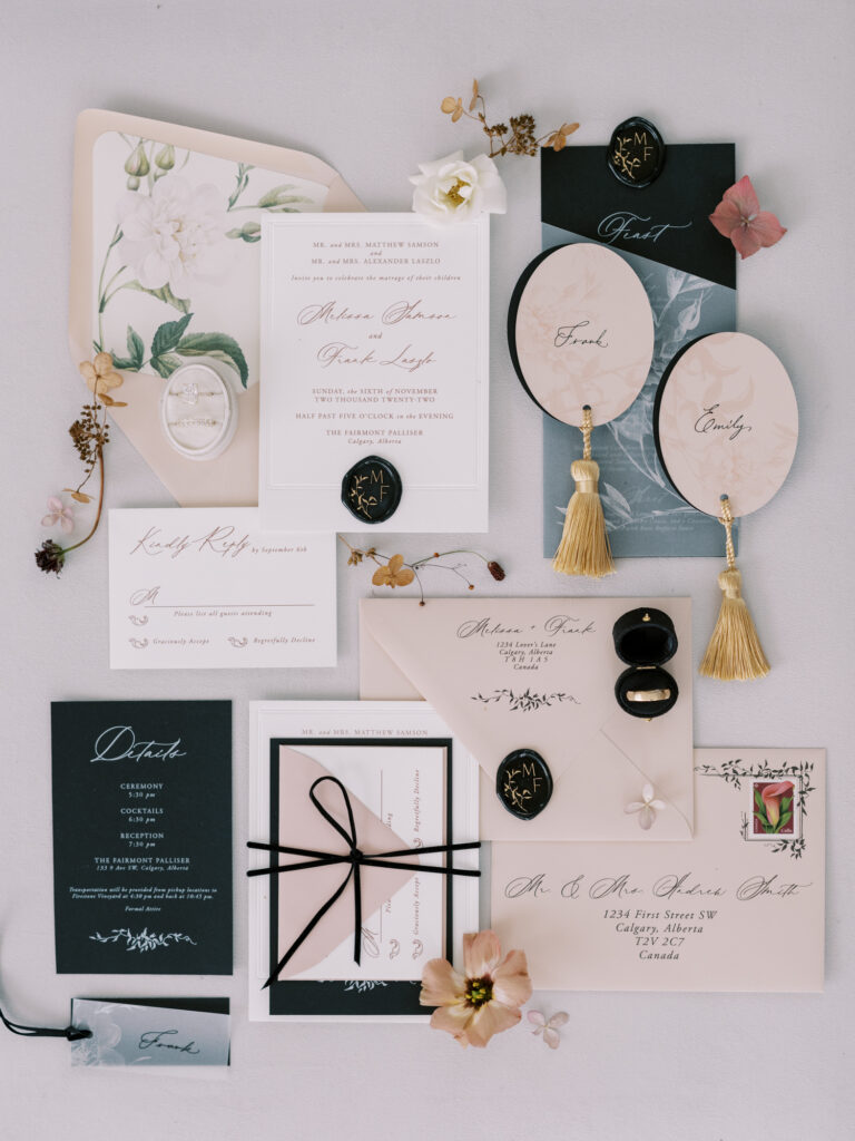 flat lay of modern black and white neutral color palette stationery wedding invitation