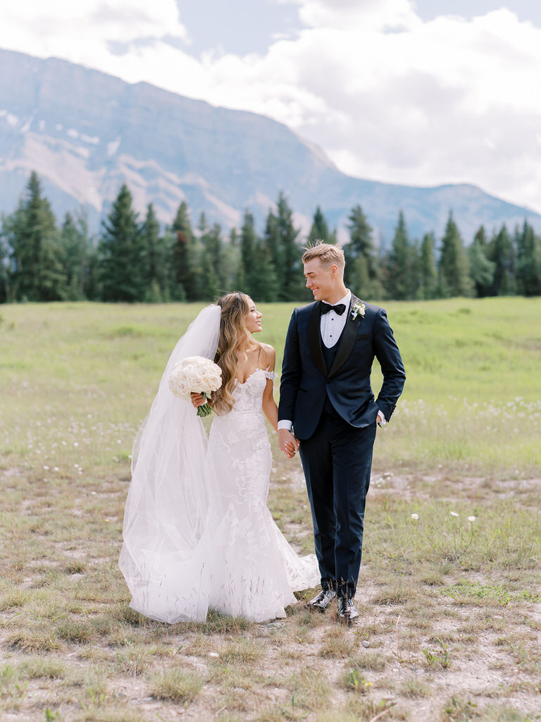 Bride and Groom wedding portrait in Canadian Rockies with wild flowers