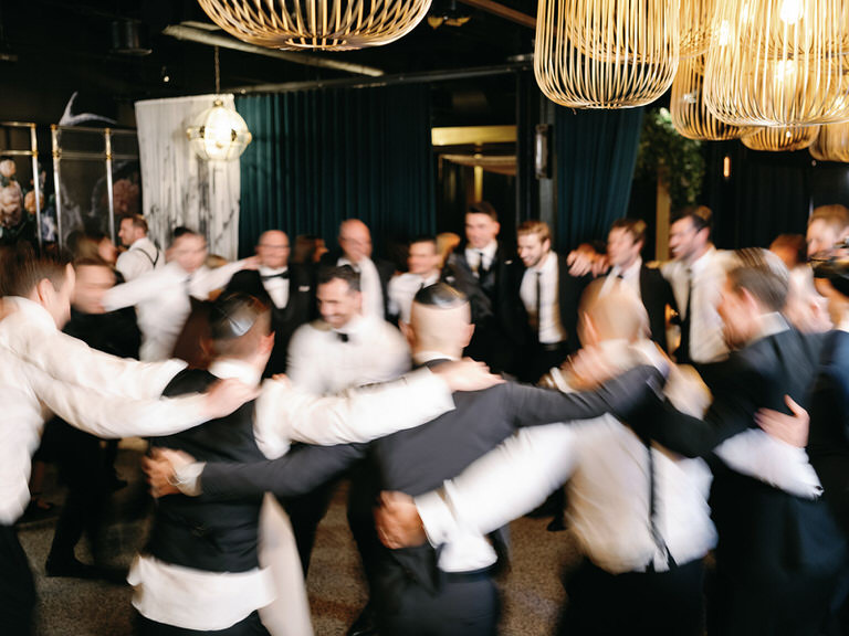 Bridal party dancing during Hora