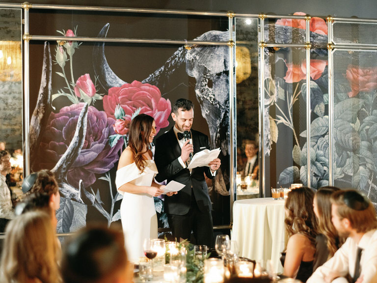 bride and groom giving wedding speech