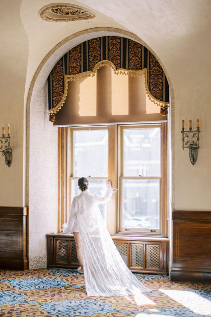 Mountain bride in wedding boudoir at Banff Springs Hotel, Canada. 
