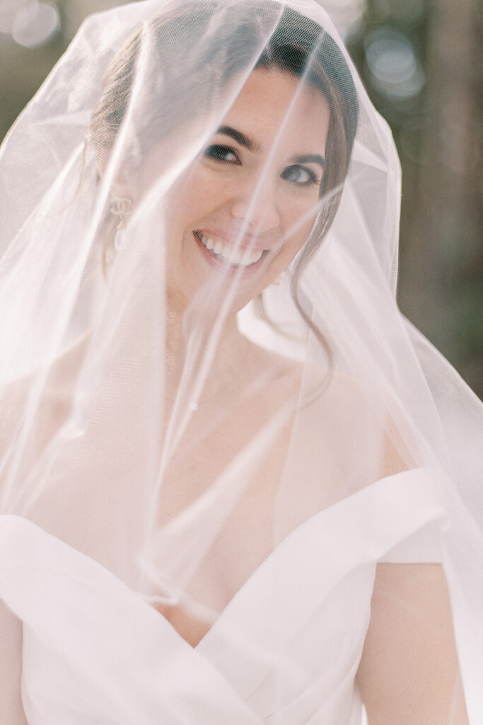 Mountain bride in strapless wedding dress with veil, portrait of bride, outside mountain photography in Banff, Canada. 