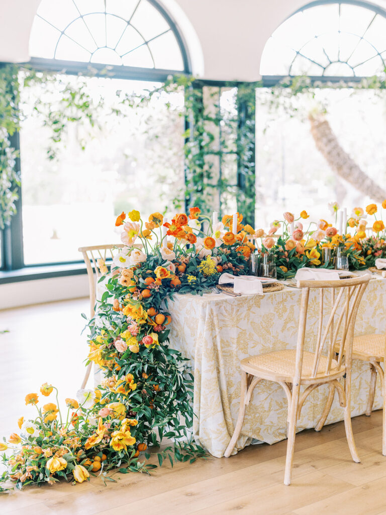 Luxurious and timeless design at Spanish-style California wedding. Full draping floral centerpieces.