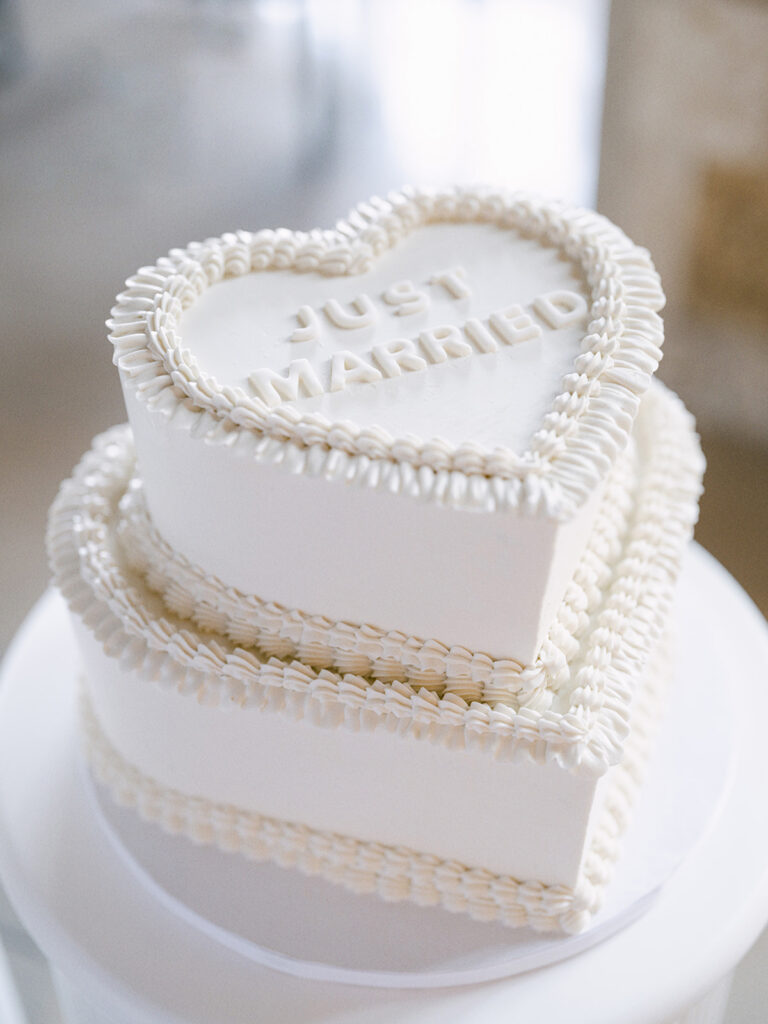 Just Married wedding cake with an old school trendy 90's vibe captured by Banff wedding photographer Justine Milton