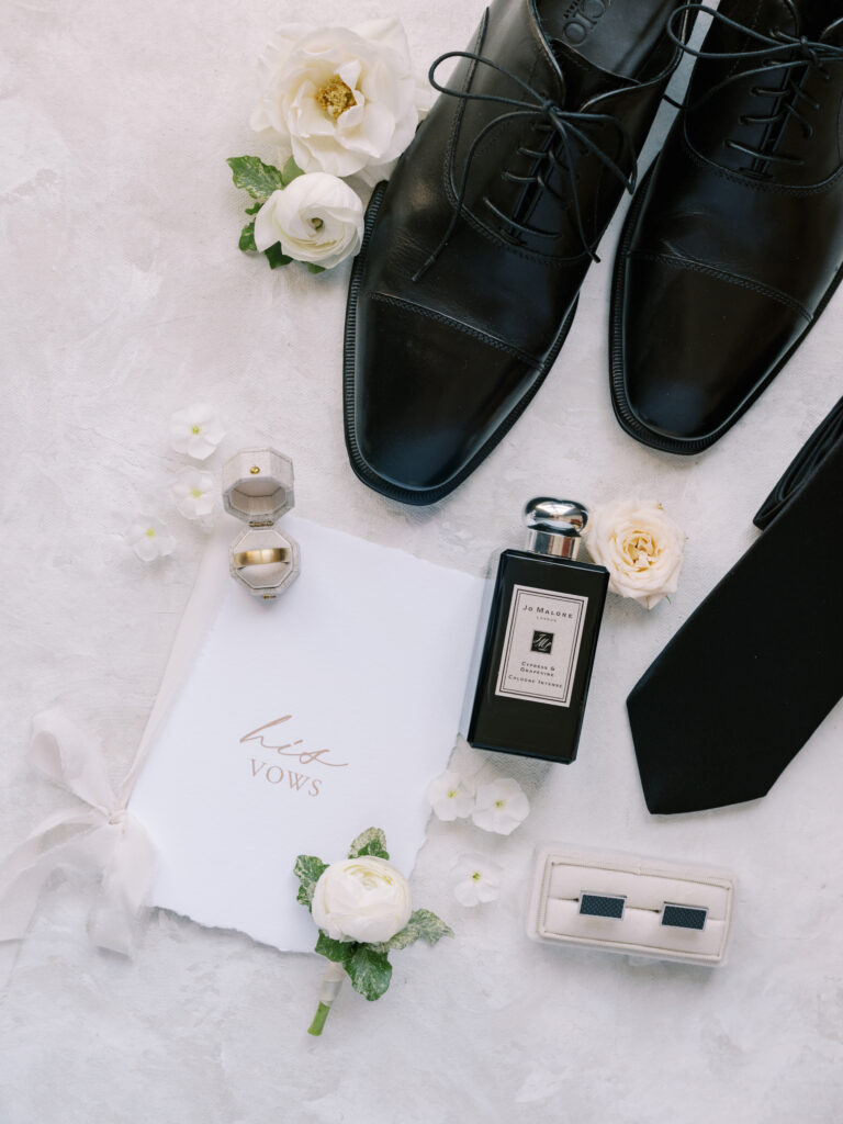 grooms personal details with custom vow book captured by Banff Wedding Photographer Justine Milton