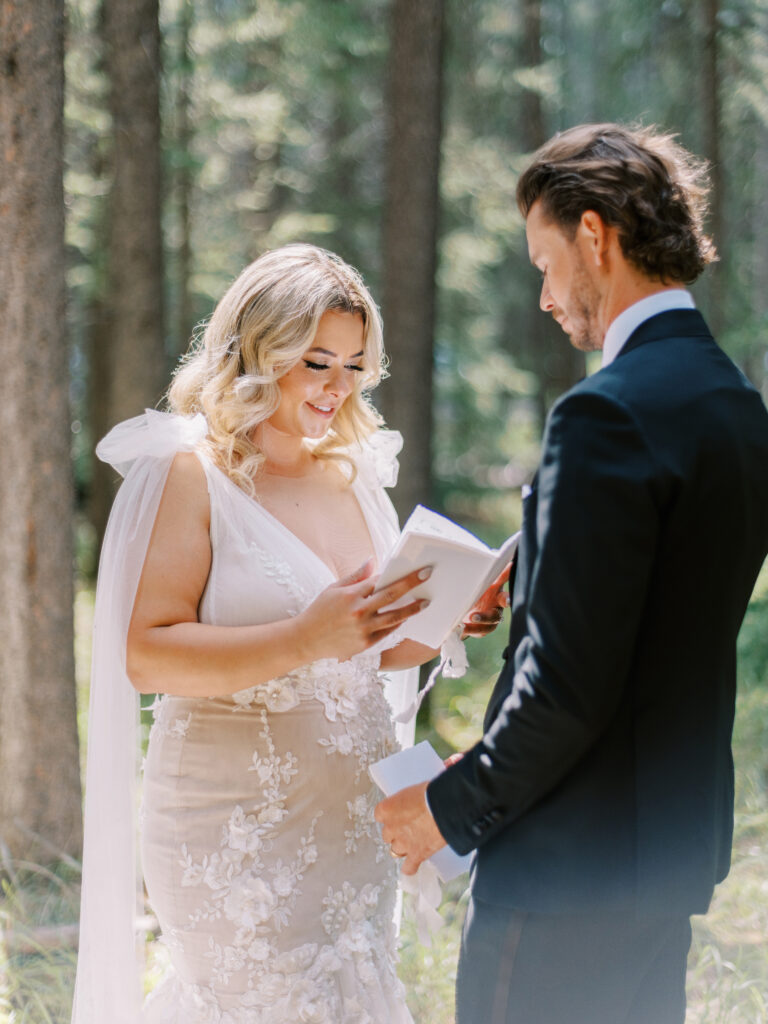 Elopement vow exchange in Banff National Park captured by Banff Wedding Photographer Justine Milton