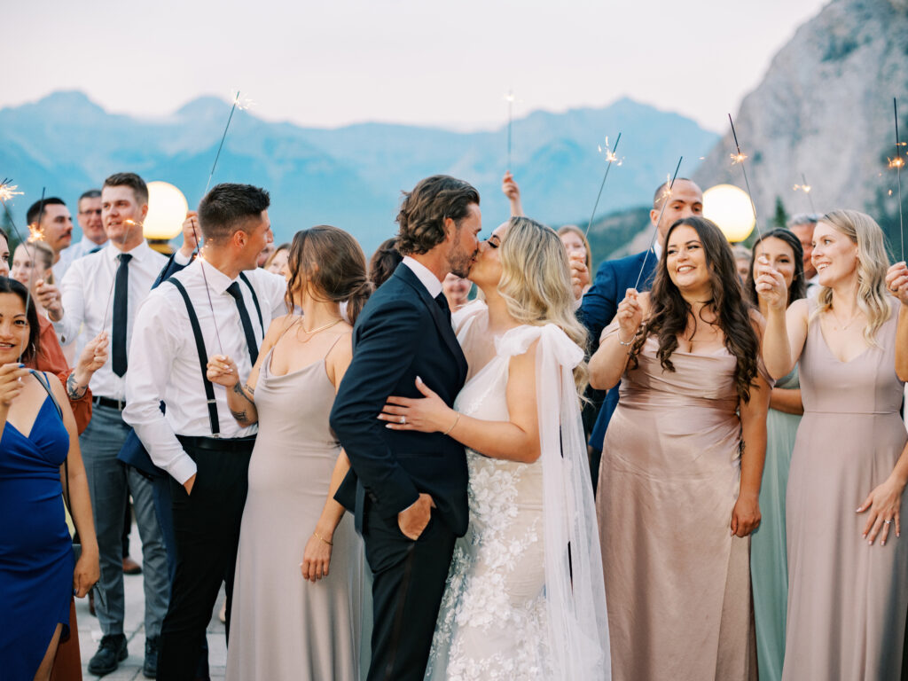 Sparkler exit on the terrace at the Fairmont Banff Springs captured by Banff Wedding Photographer Justine Milton
