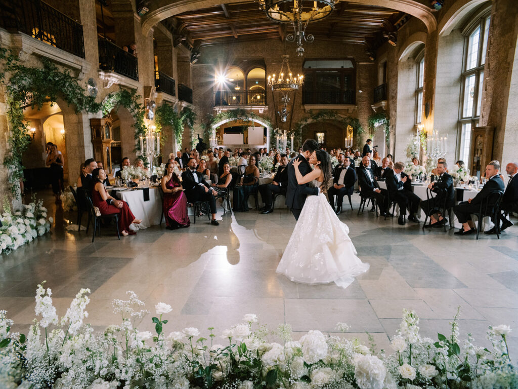 Banff wedding photographer captured bride and groom during their first dance at the Fairmont Banff Springs Hotel, castle in the rockies.